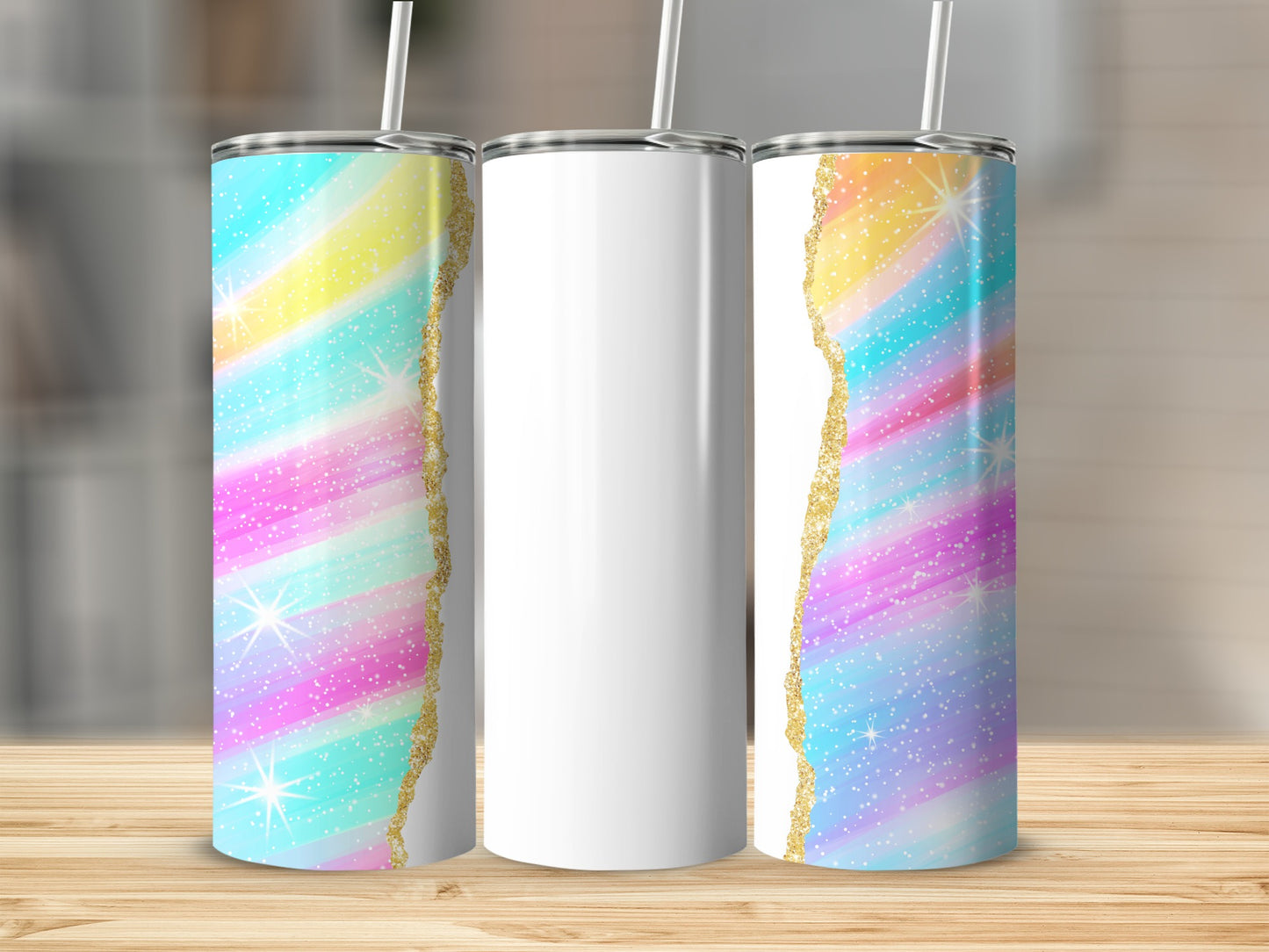 Three tumblers with colorful glittery backgrounds and gold trim.