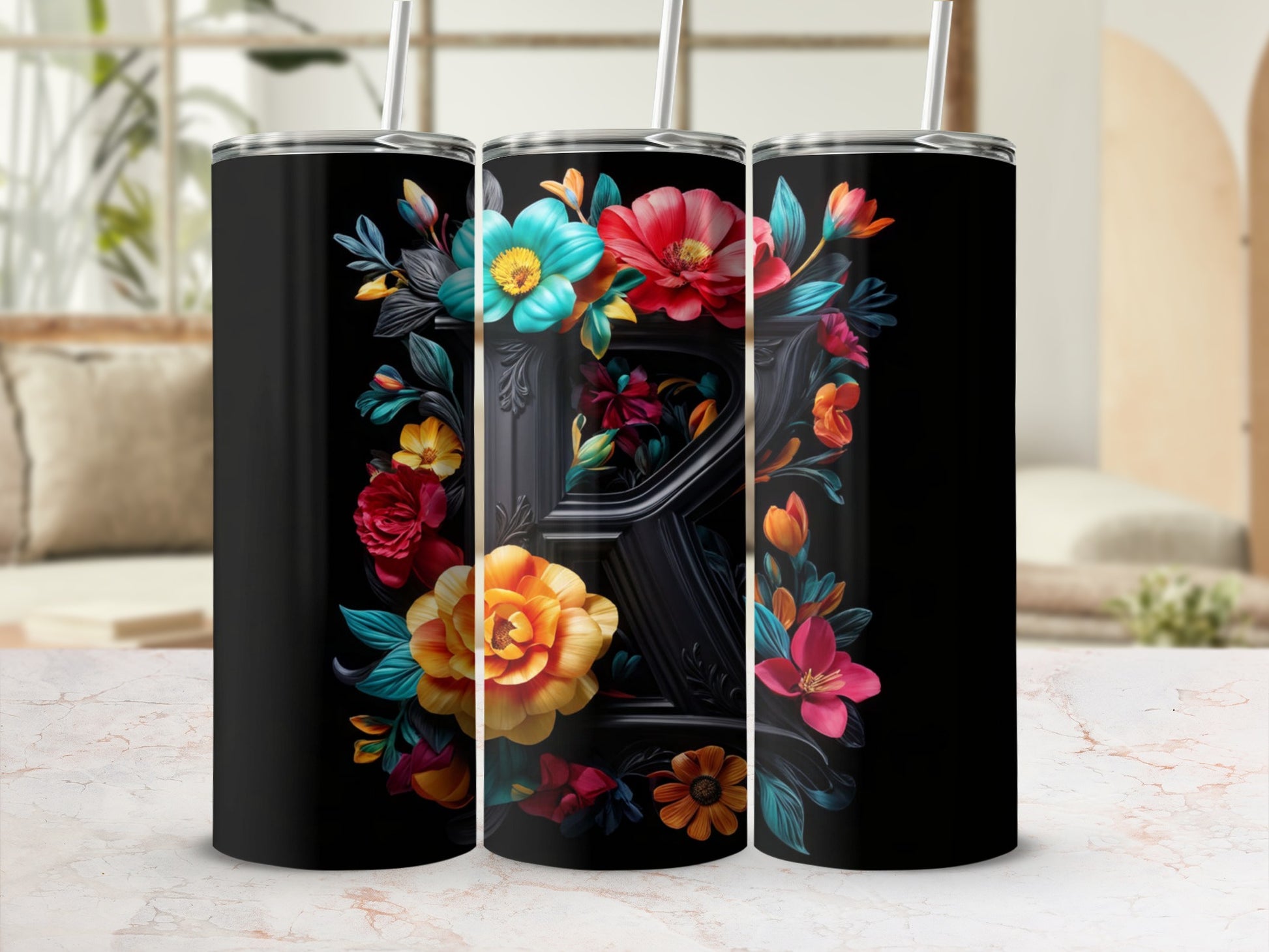 Black tumbler with colorful floral design around a black letter R.
