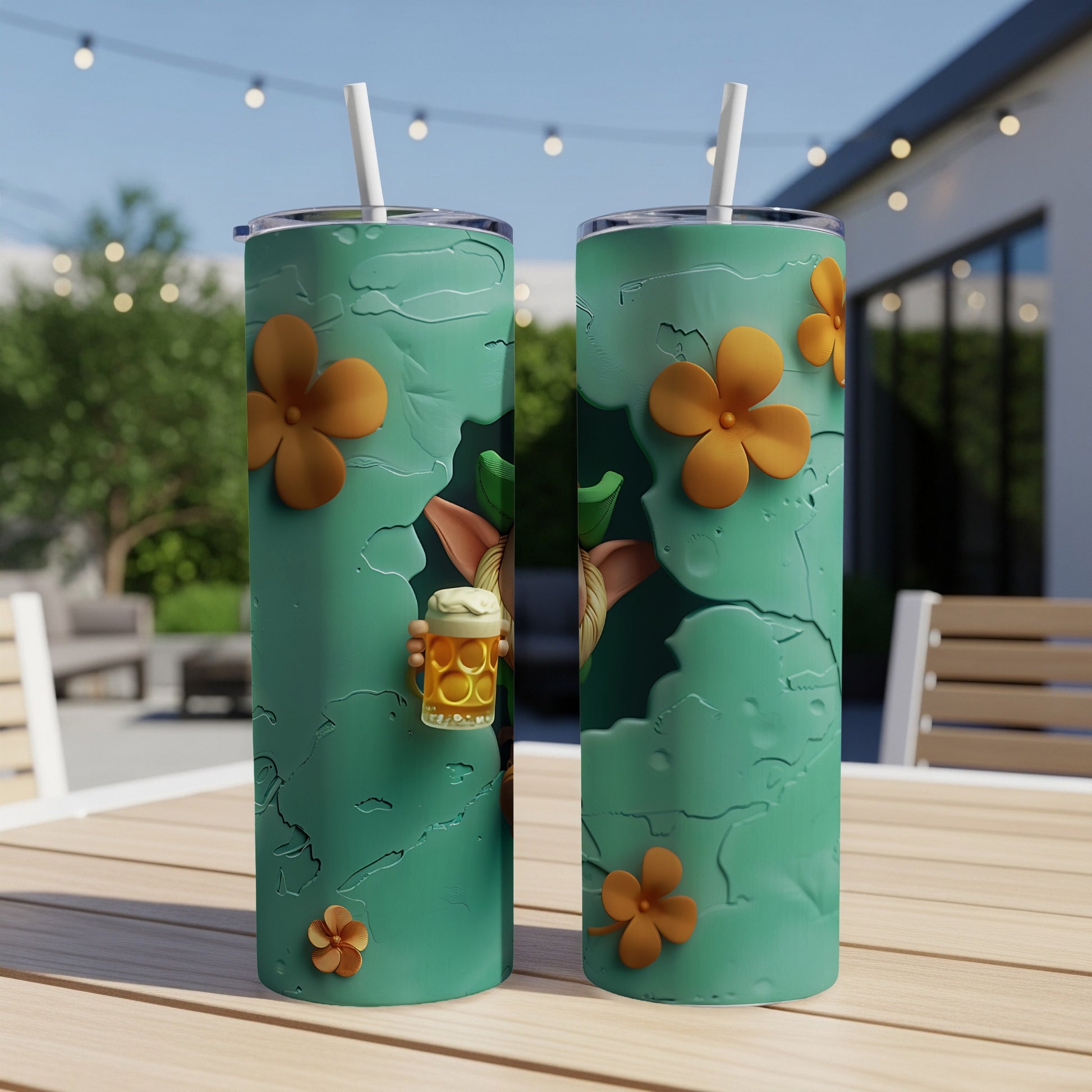 Two teal tumblers with a distressed pattern and orange flowers, one with a small character holding a beer mug.
