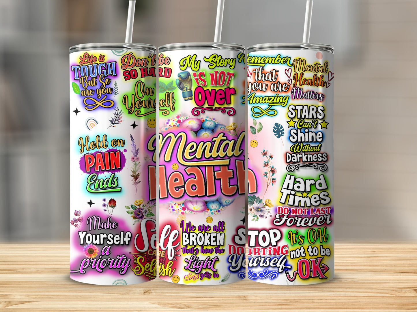 Floral mental health tumbler with inspirational quotes in rainbow colors.