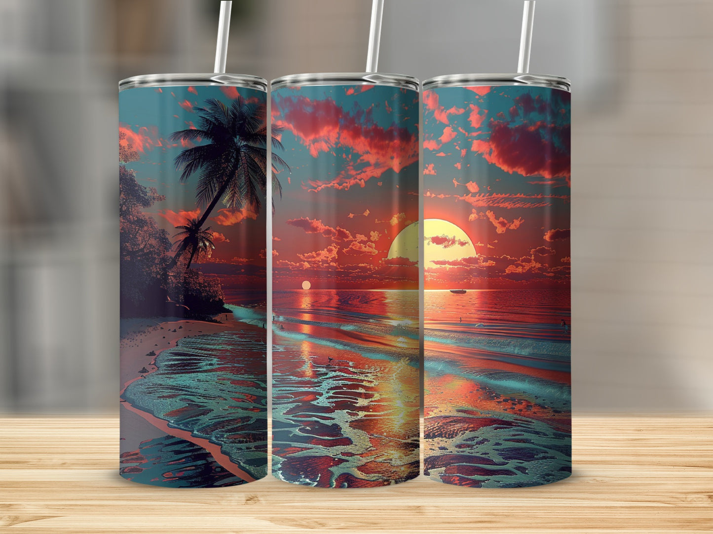Three tumblers with a tropical sunset beach scene wrap around them.