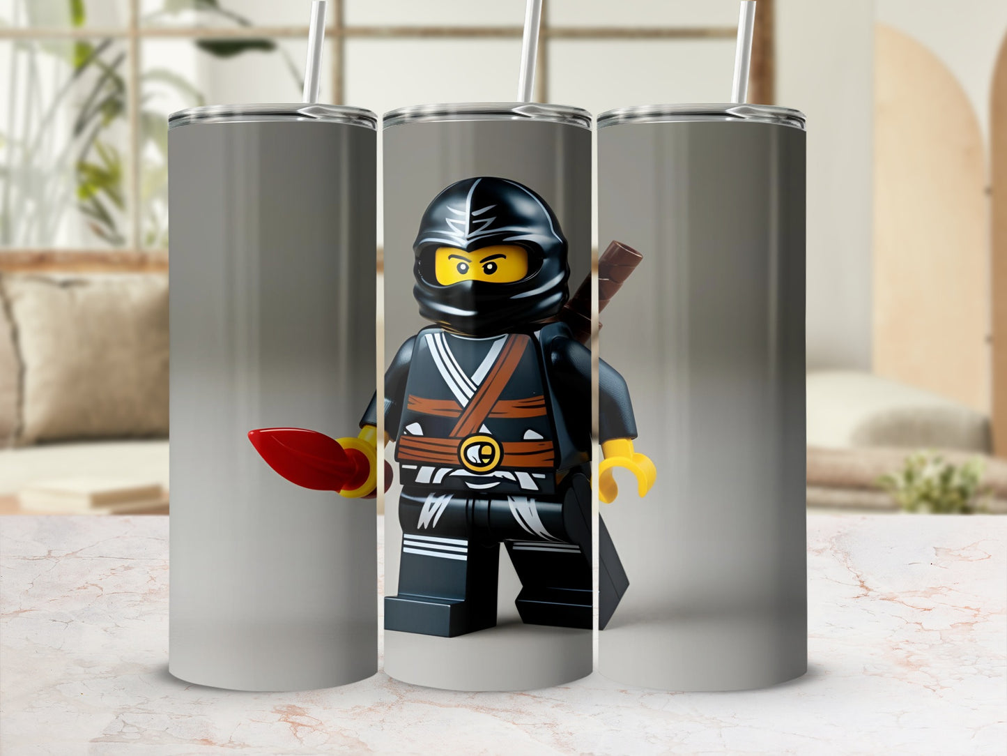 Lego ninja figure with red sword on a stainless steel tumbler.