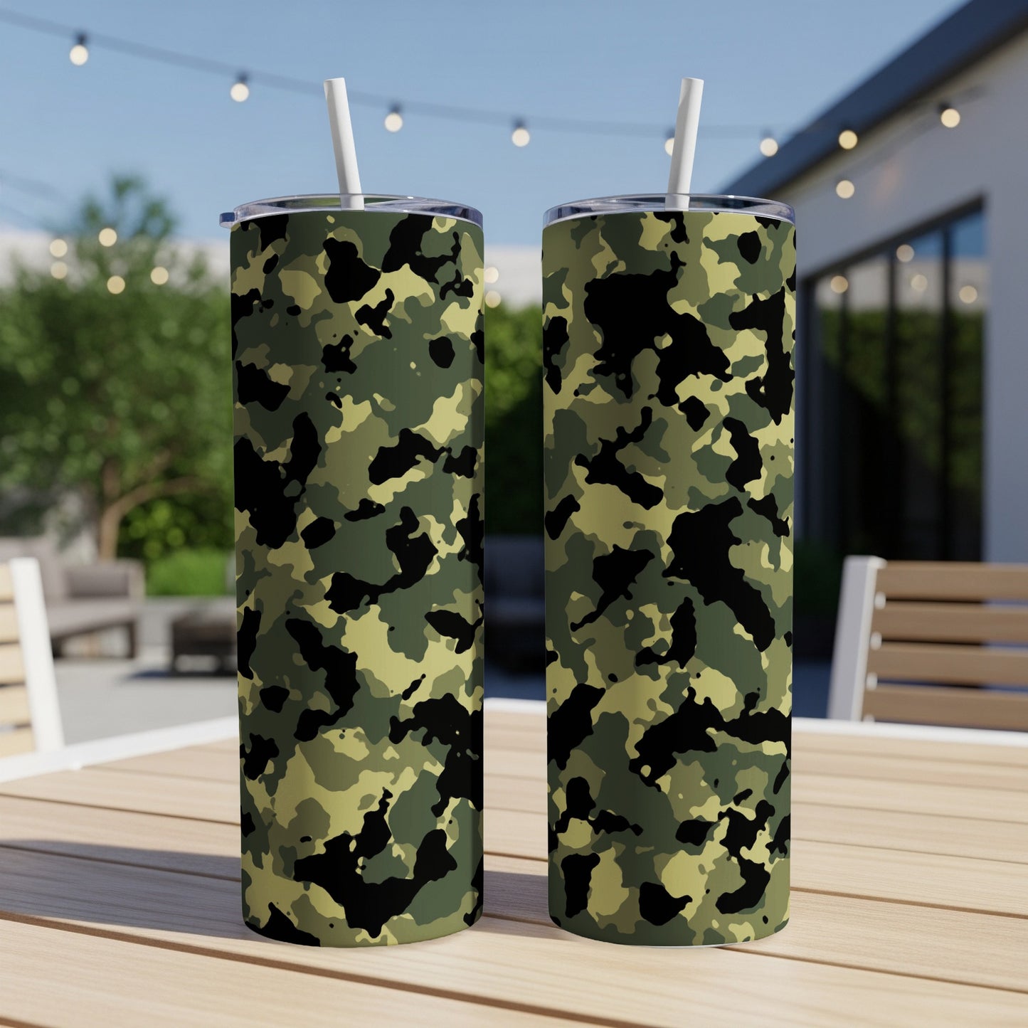 Two tall tumblers with green, black, and tan camouflage pattern, each with a white straw.