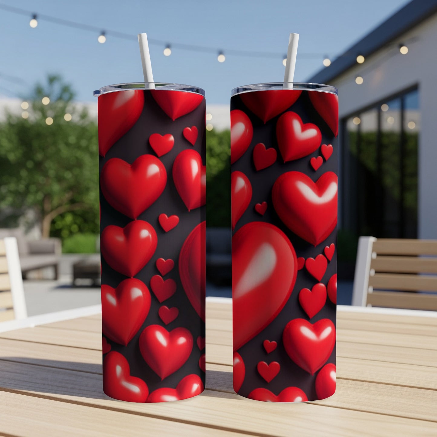 Two tall tumblers with a repeating pattern of red hearts.