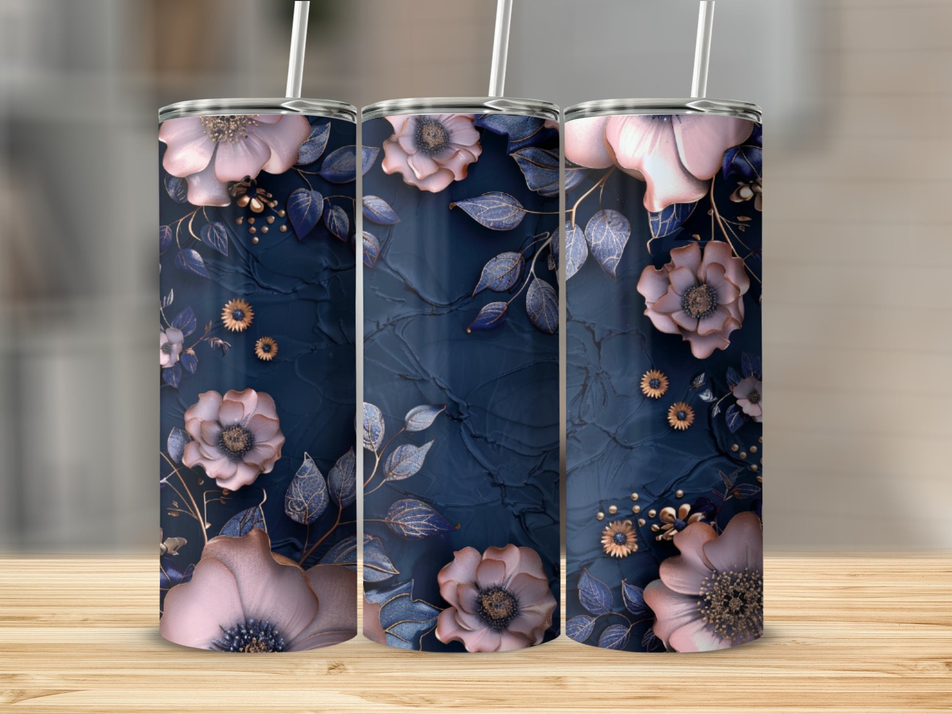 Three tumblers with dark blue floral and gold leaf designs.
