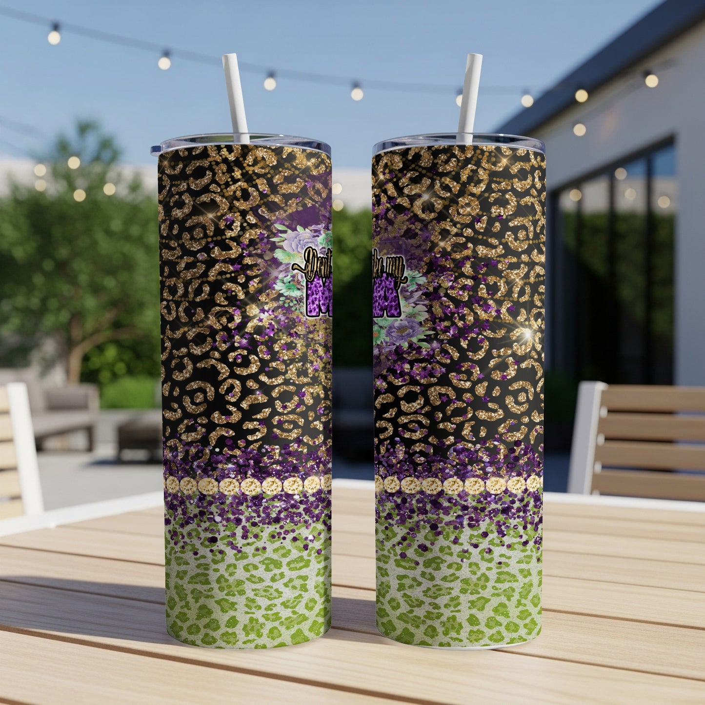 Two tall tumblers with leopard print, glitter, and floral designs.