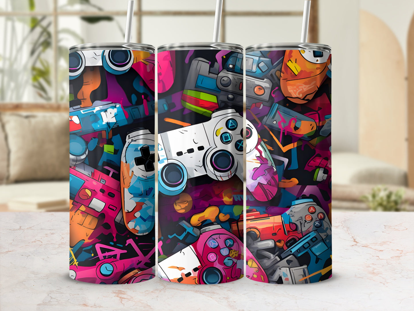Three tumblers with colorful, abstract video game controller designs.