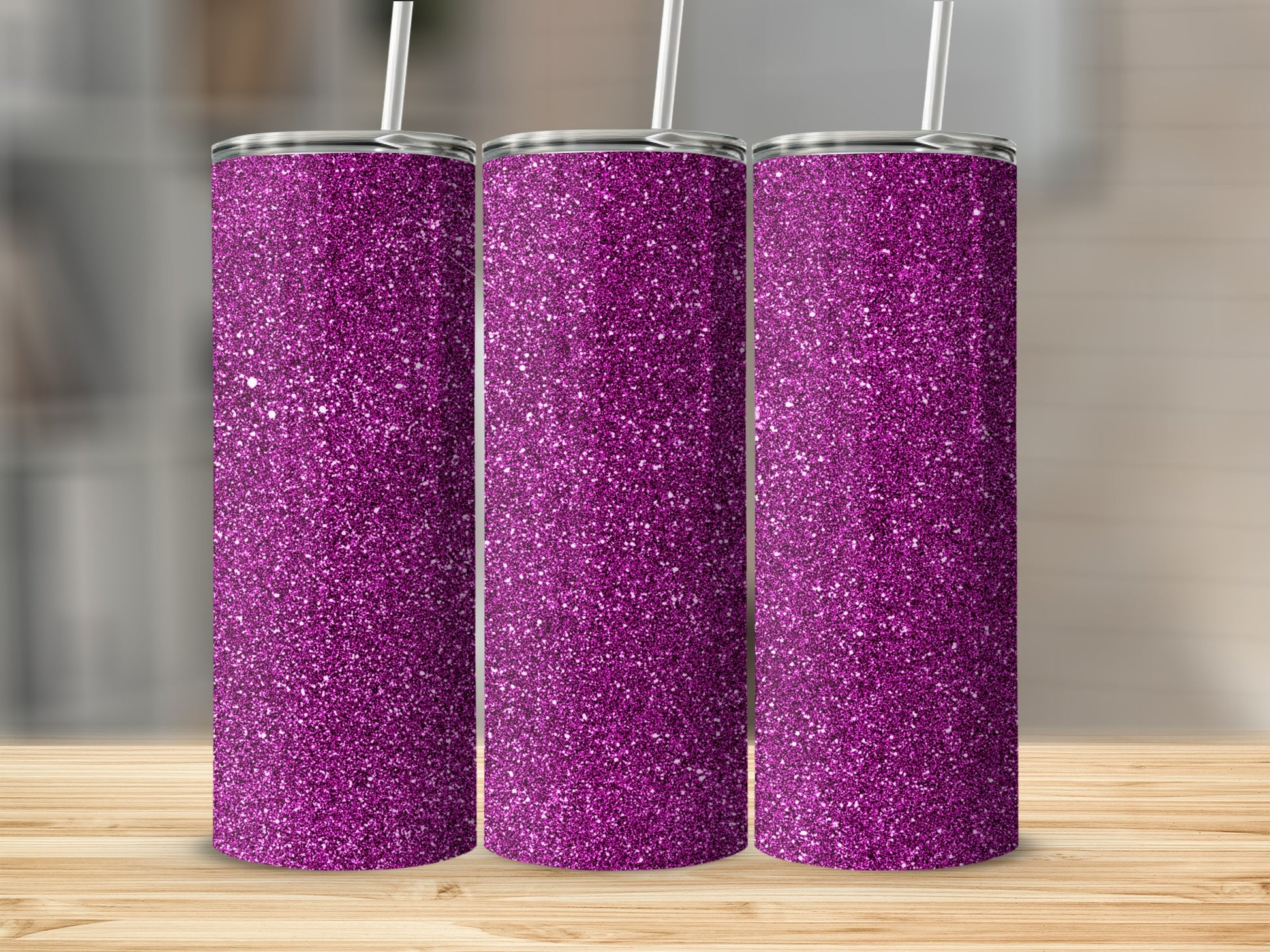 Three glitter tumblers in vibrant purple with white straws, displayed on a wooden surface.
