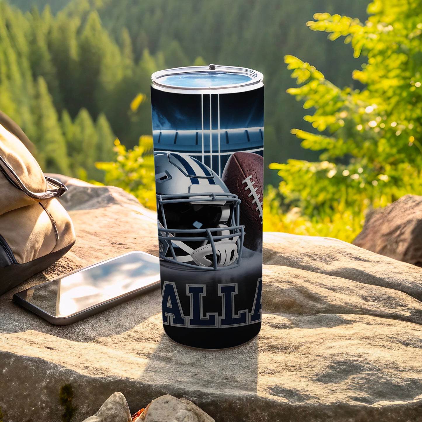 Dallas Cowboys helmet and football on a tumbler with a stadium background.