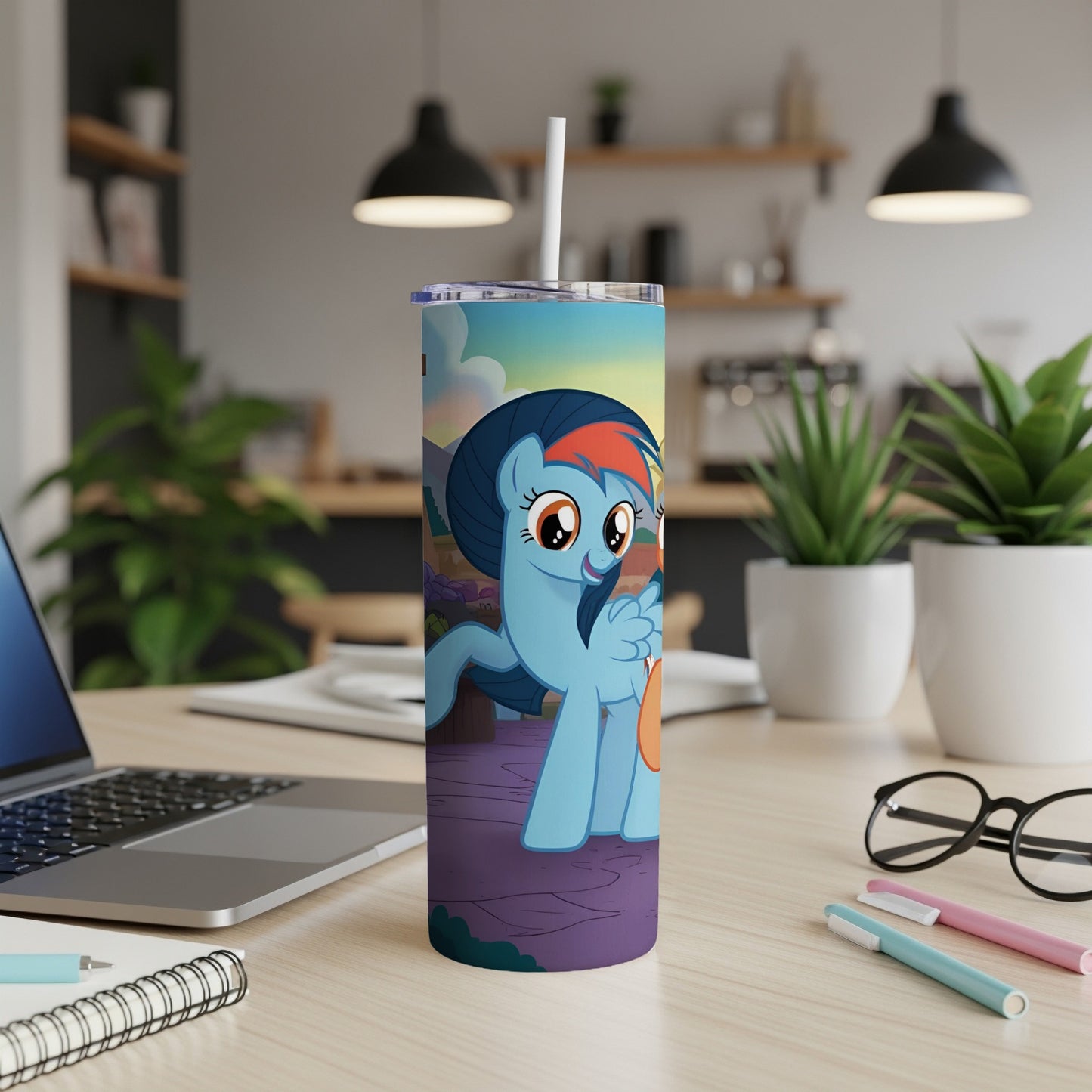 Rainbow Dash from My Little Pony on a blue skinny tumbler with a straw.