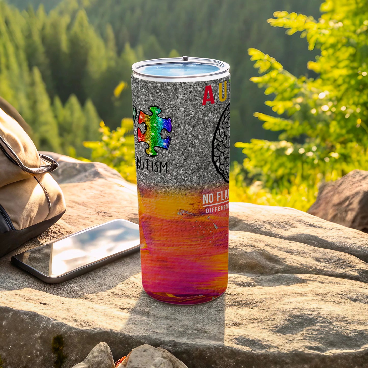 Autism awareness tumbler with colorful puzzle piece and text.