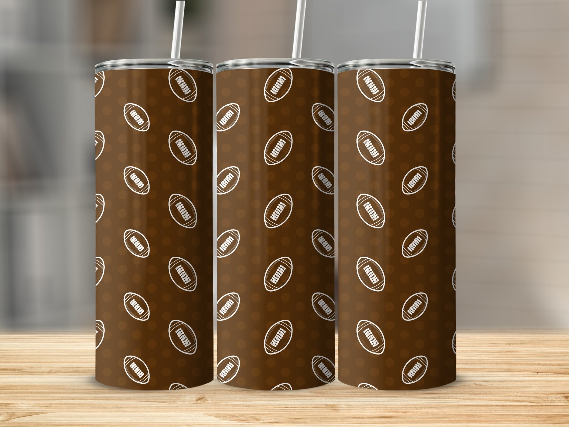 Three brown tumblers with white footballs and dots pattern, each with a straw.