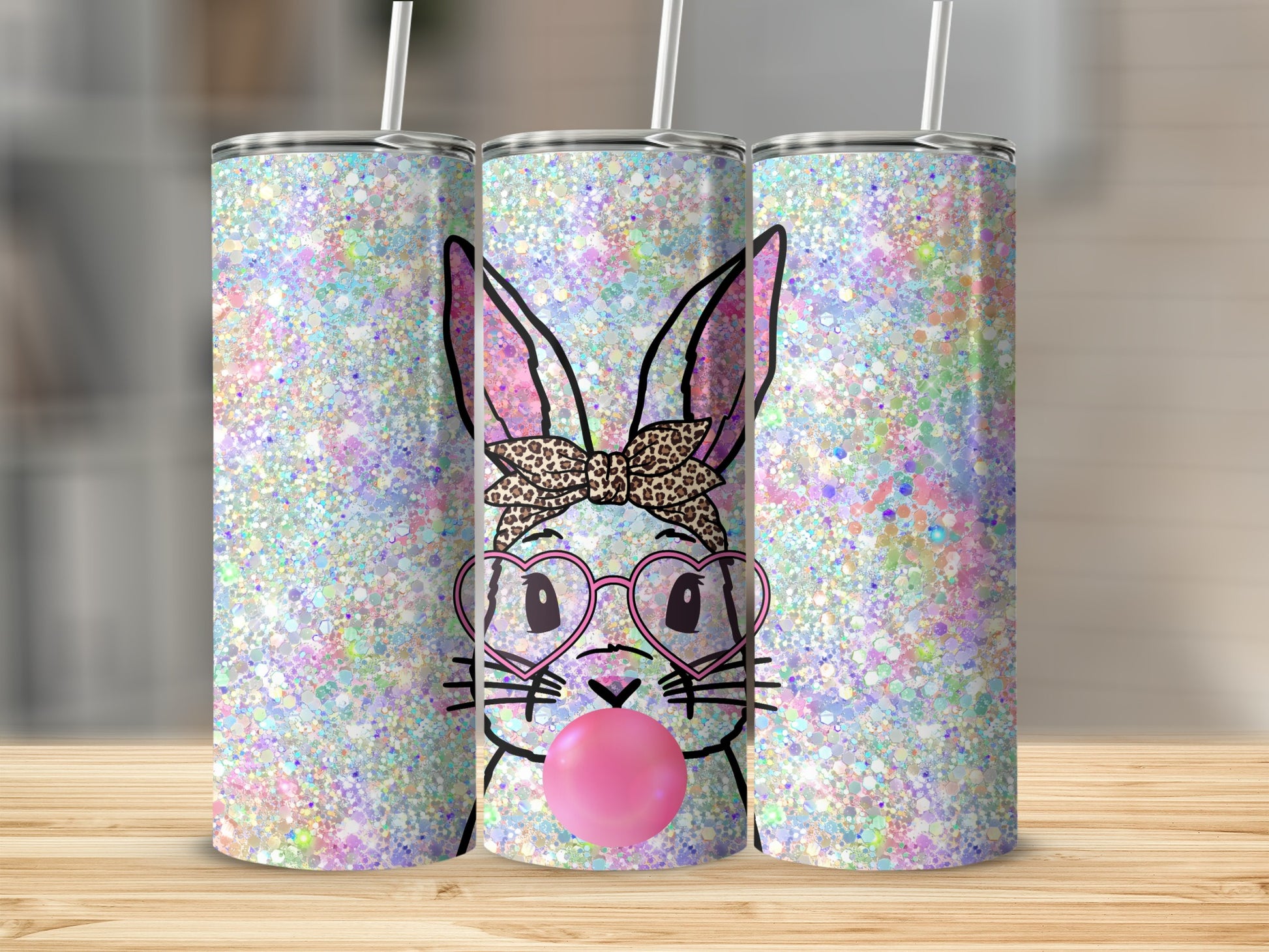 Bunny with glasses and bow blowing bubblegum on a glittery tumbler.