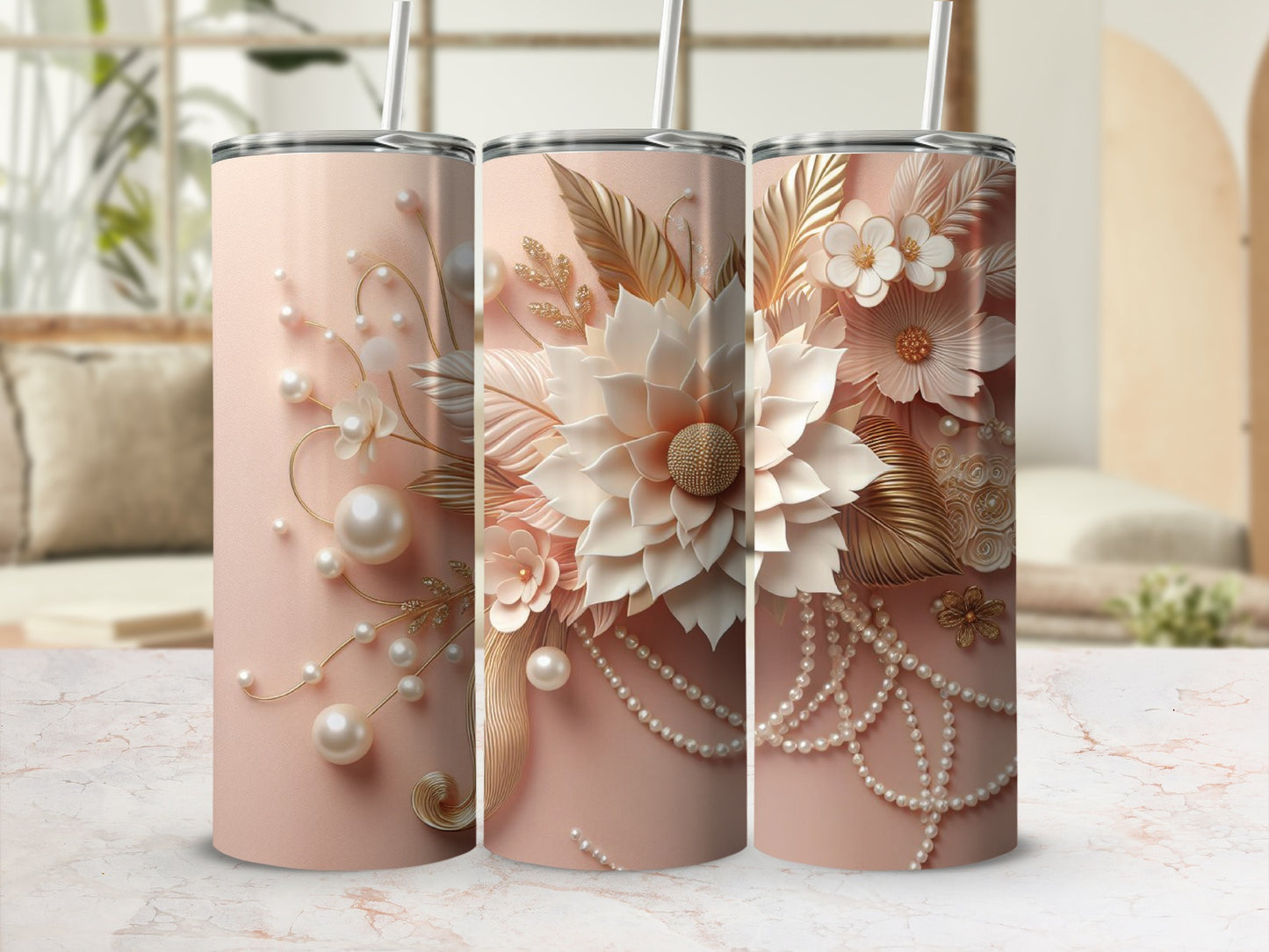 Three pink tumblers with floral and pearl embellishments.