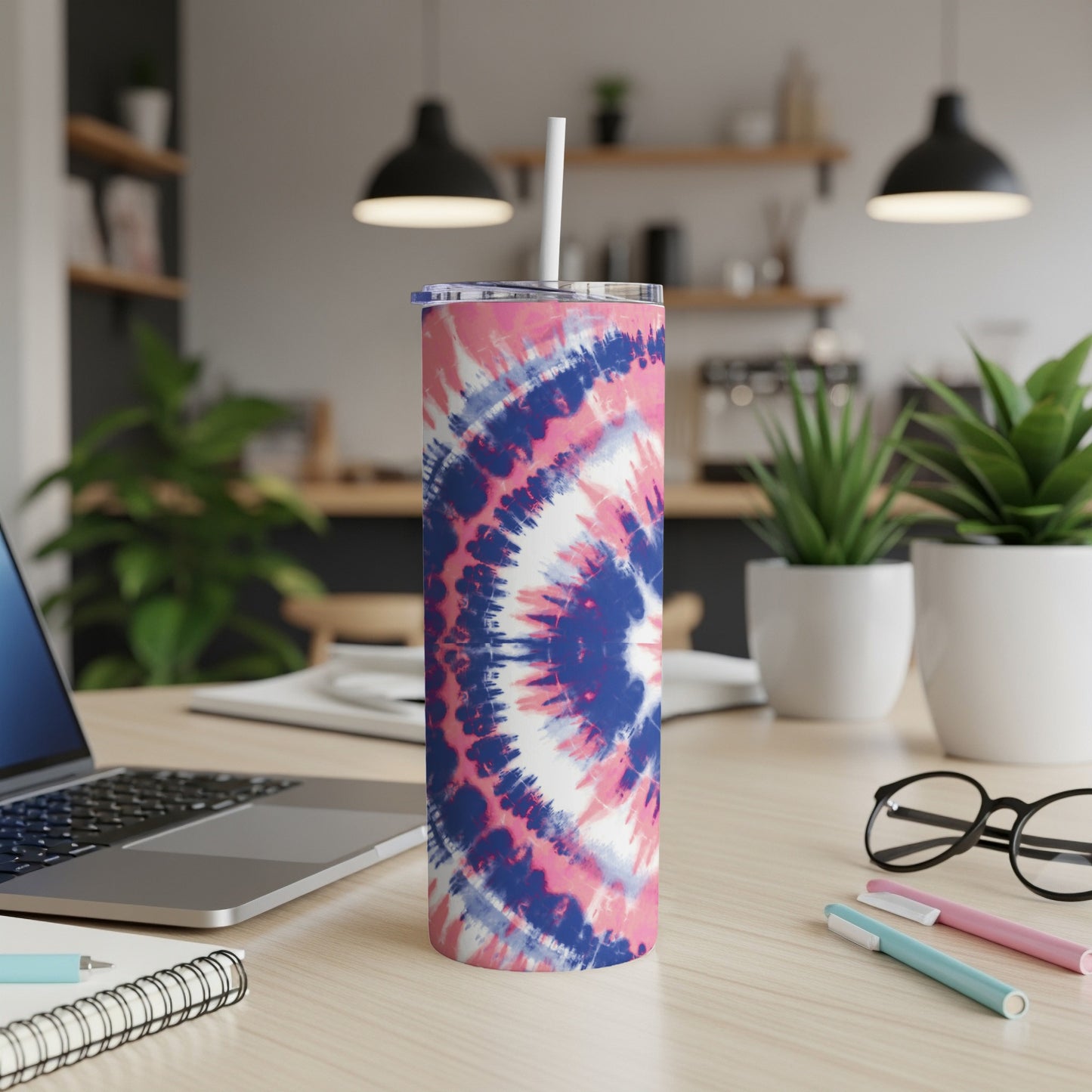 Tall stainless steel tumbler with pink, blue, and white tie-dye pattern.