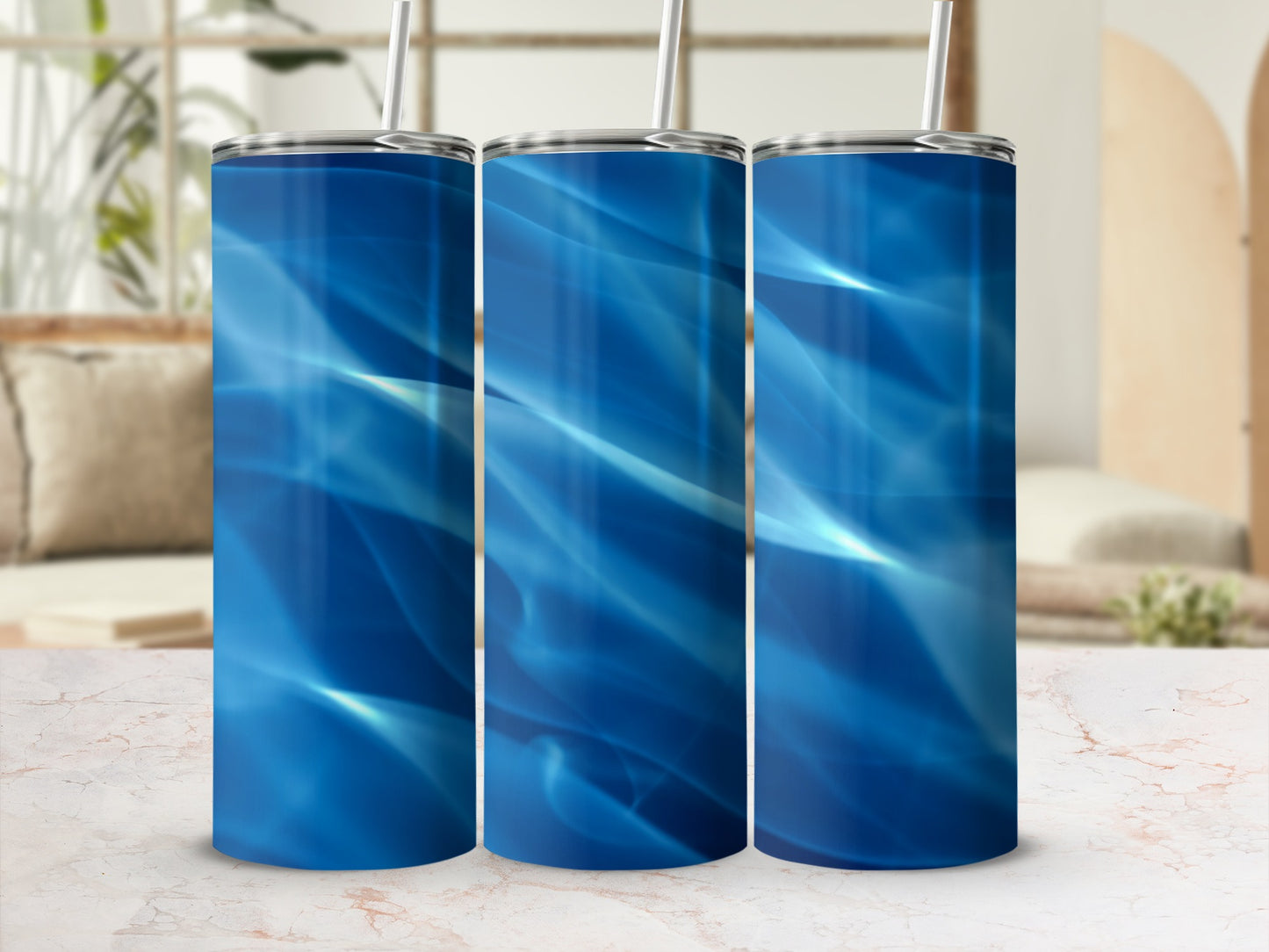 Three blue abstract wave pattern tumblers with straws.