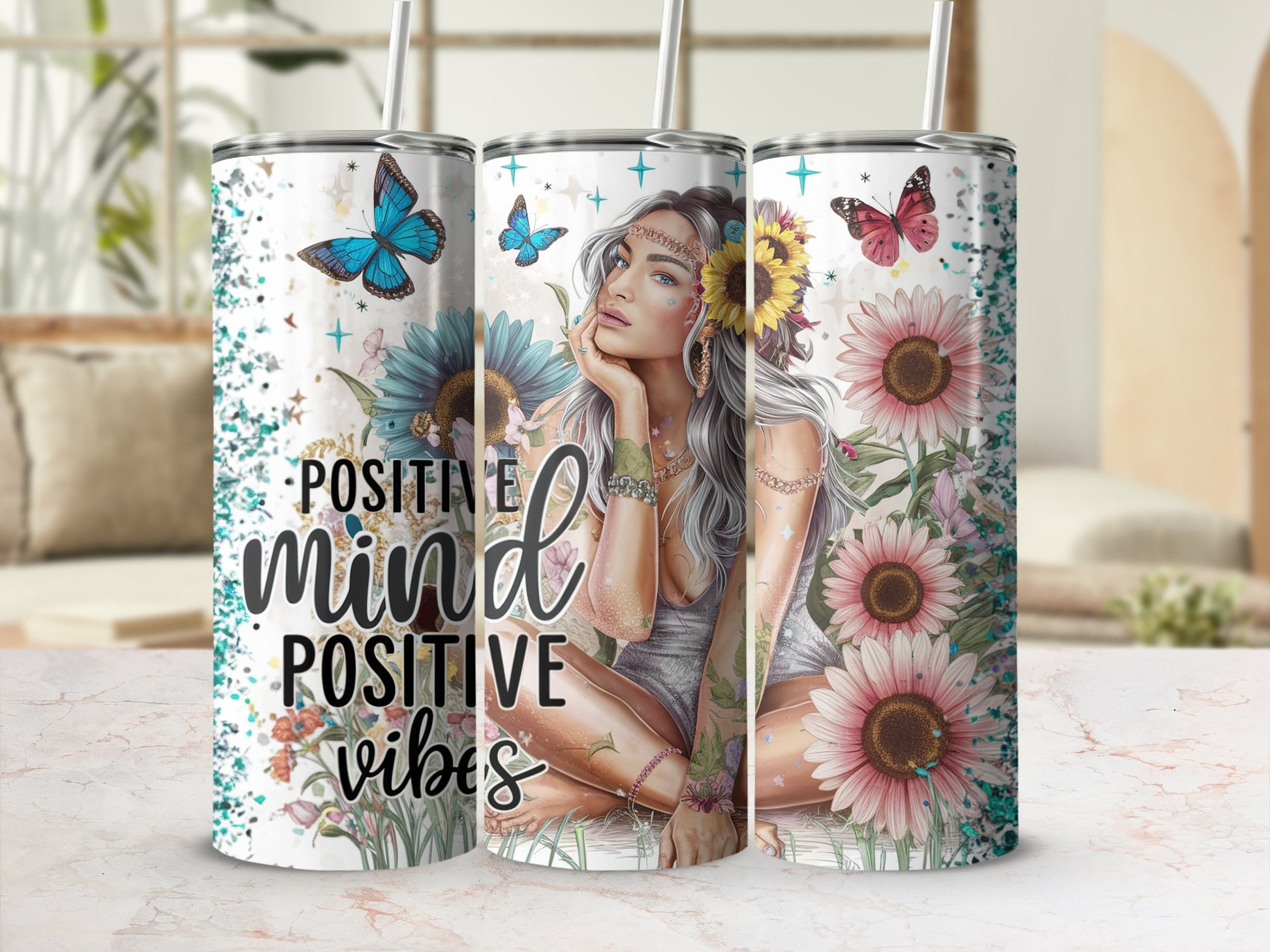 "Positive mind positive vibes" text on a tumbler with a woman, butterflies, and flowers.