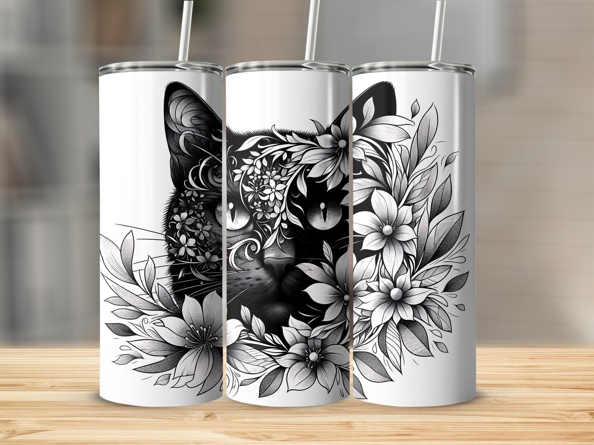 Black cat with floral accents on three white skinny tumblers.