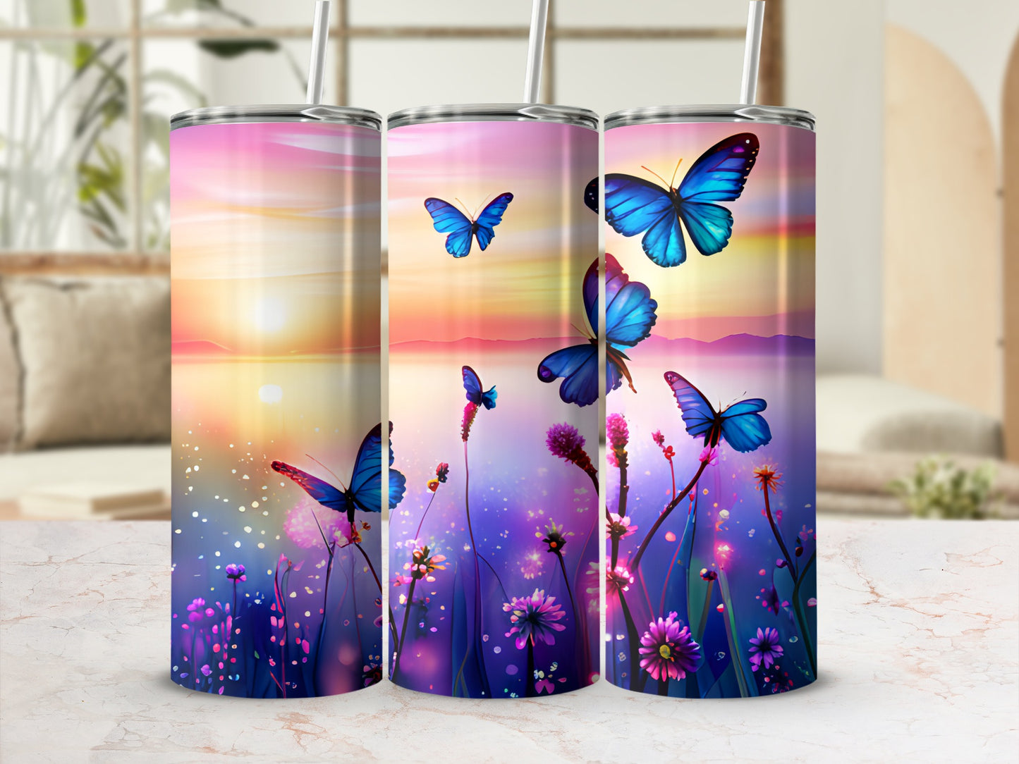 Three tumblers with a sunset and butterfly design.