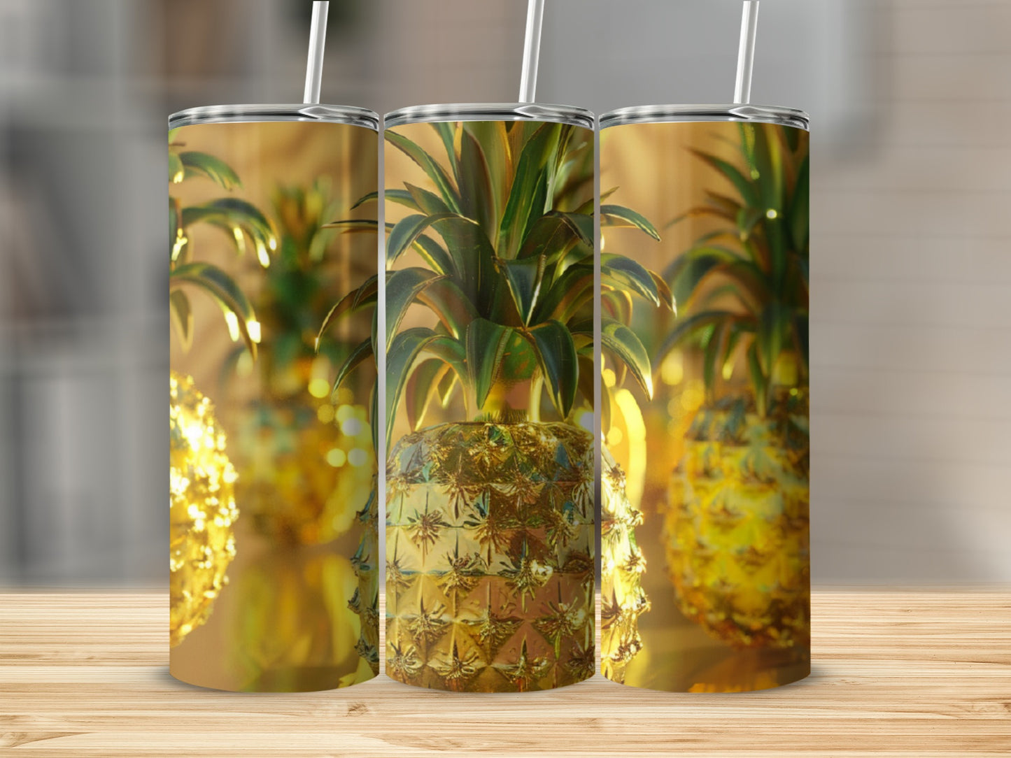 Three golden pineapples with textured surfaces on a wooden surface.