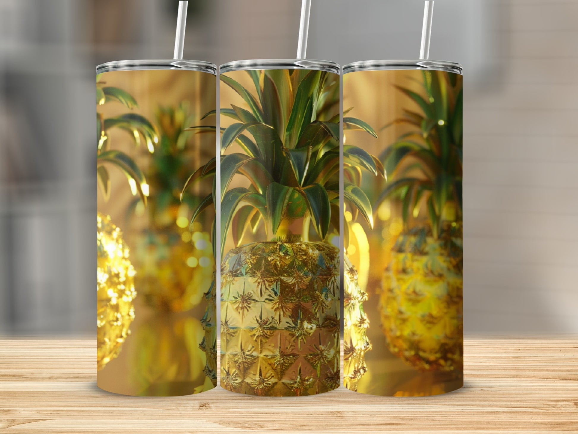 Three golden pineapples with textured surfaces on a wooden surface.