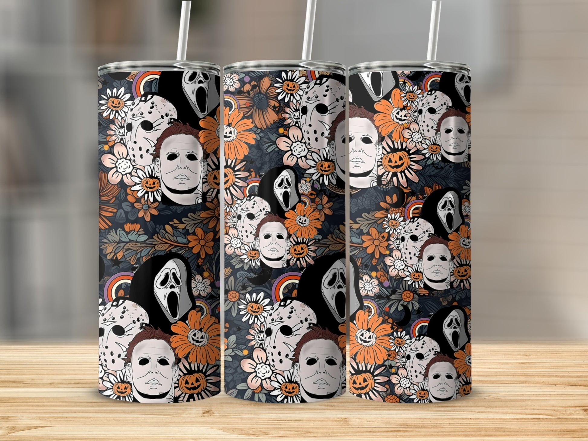 Tumbler with repeating pattern of horror movie characters and flowers.
