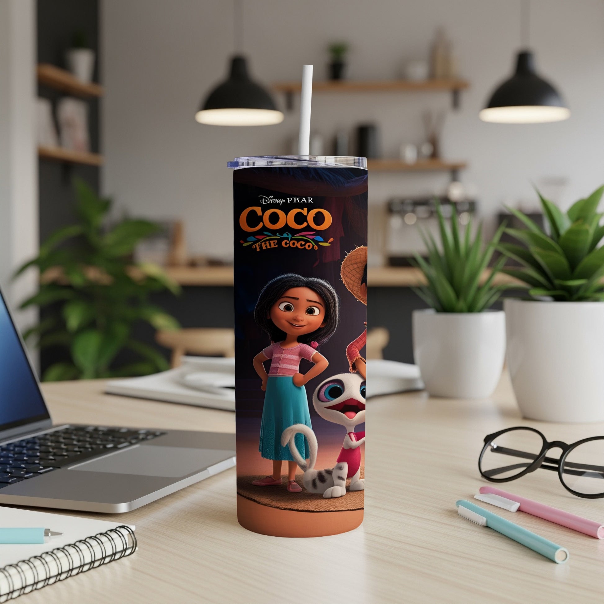 Coco The Coco tumbler with Miguel and Dante on a desk.