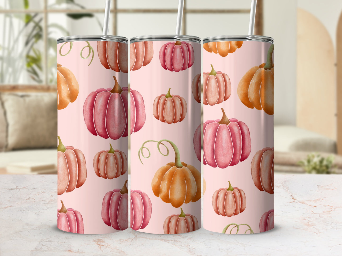 Pink tumbler with an all-over pattern of various orange and pink pumpkins.