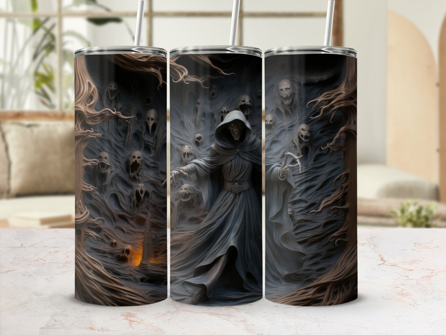 Three tumblers with a dark, gothic design featuring a cloaked figure and ghostly skulls.