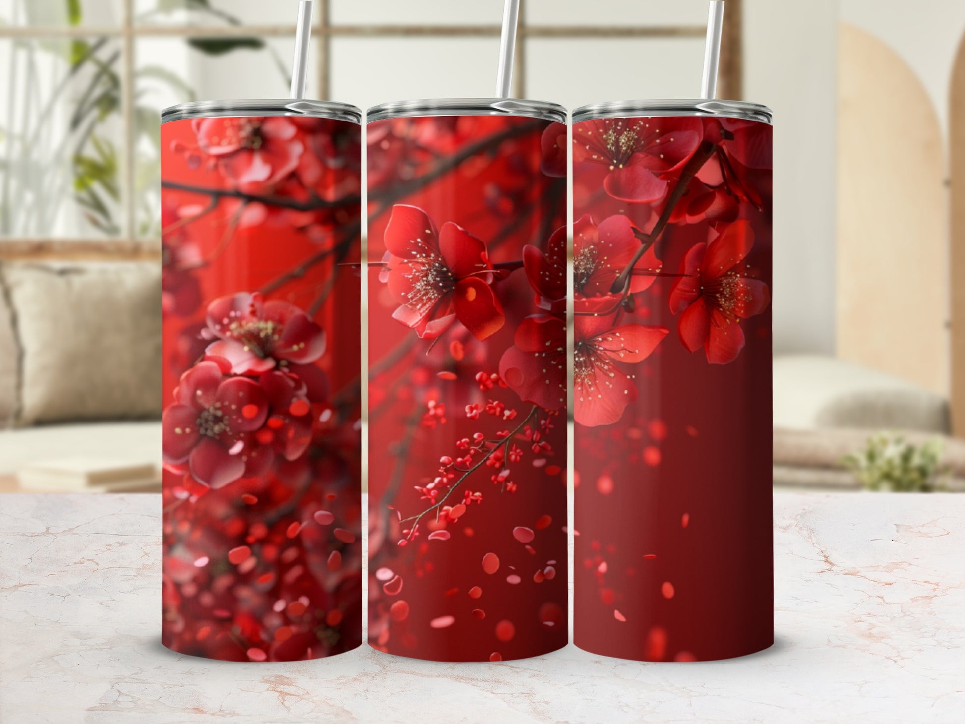 Three tumblers featuring red cherry blossoms against a blurred background.