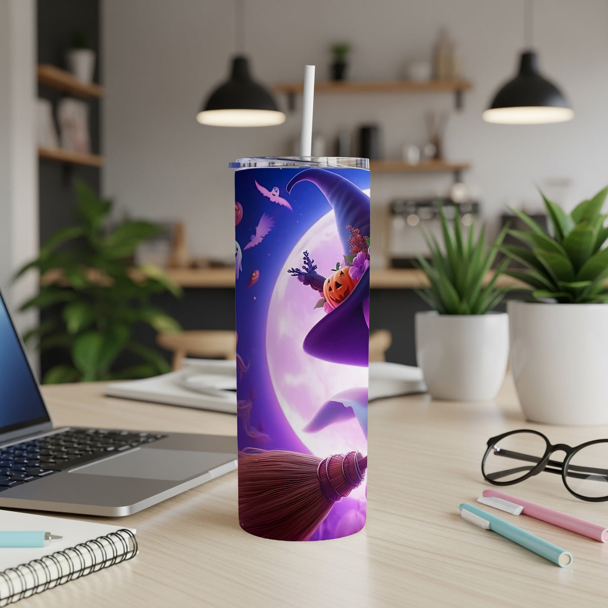 Tumbler with Halloween design featuring witch hat, pumpkin, and flying ghosts against a full moon.
