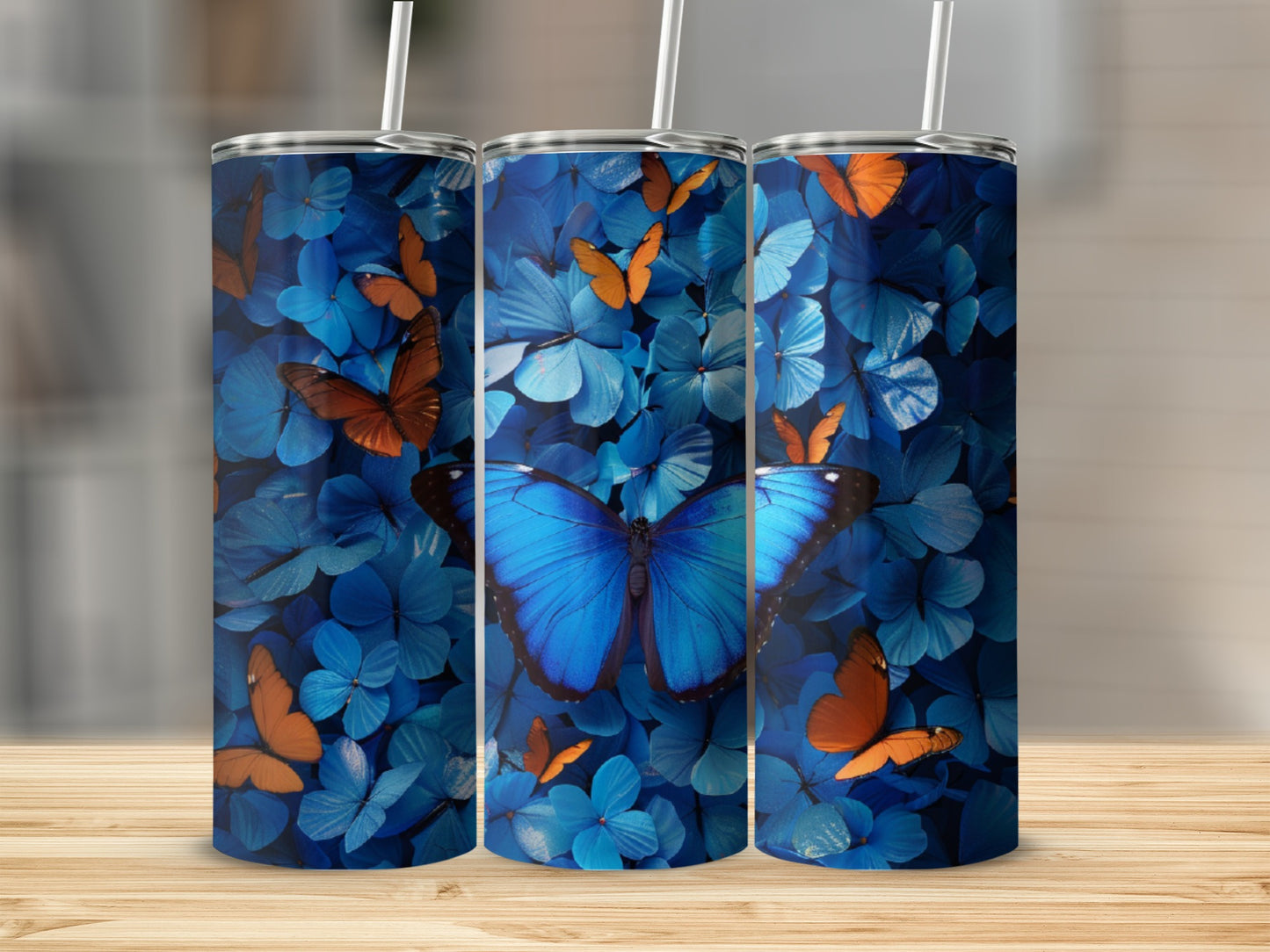 Blue and orange butterflies on a blue floral background tumbler.