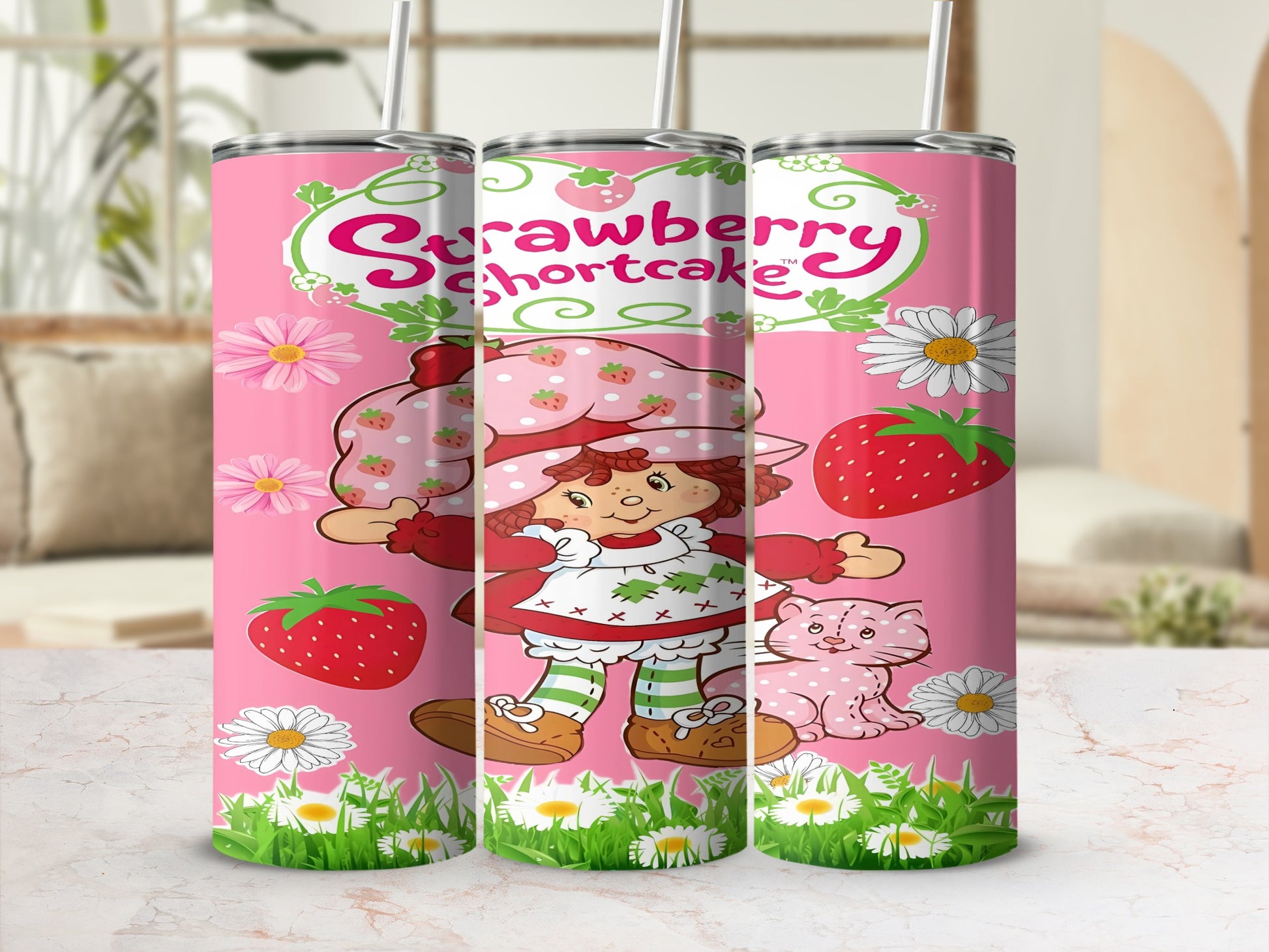 Strawberry Shortcake character with cat on a pink tumbler with strawberries and daisies.