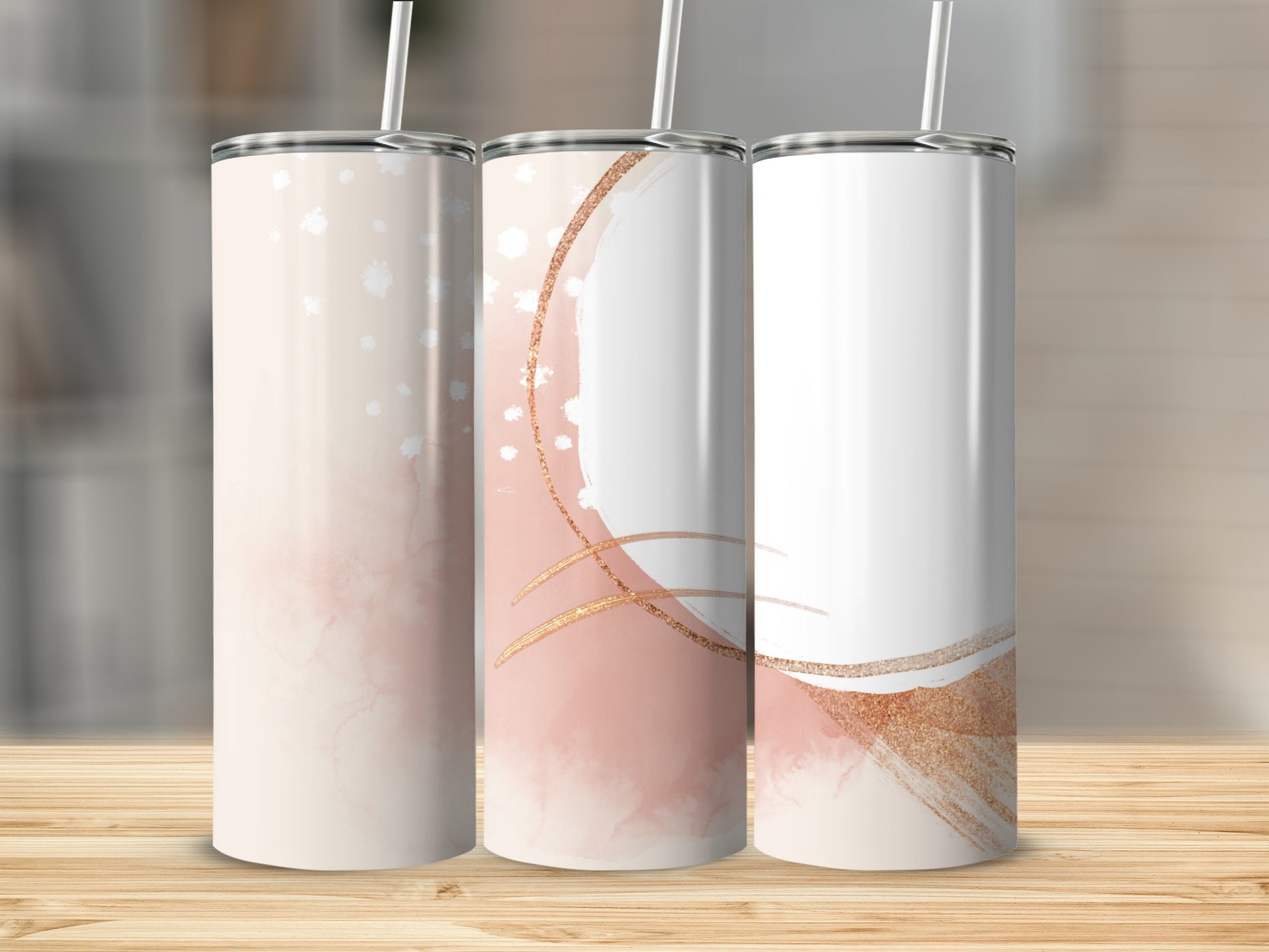 Three tall, slim tumblers with a watercolor and glitter design.