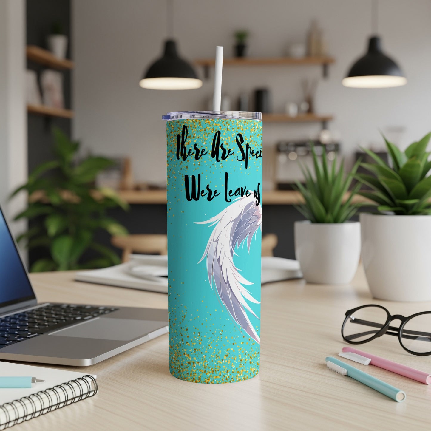 Teal tumbler with white wings and gold glitter, text "There Are Special Were Leaving".