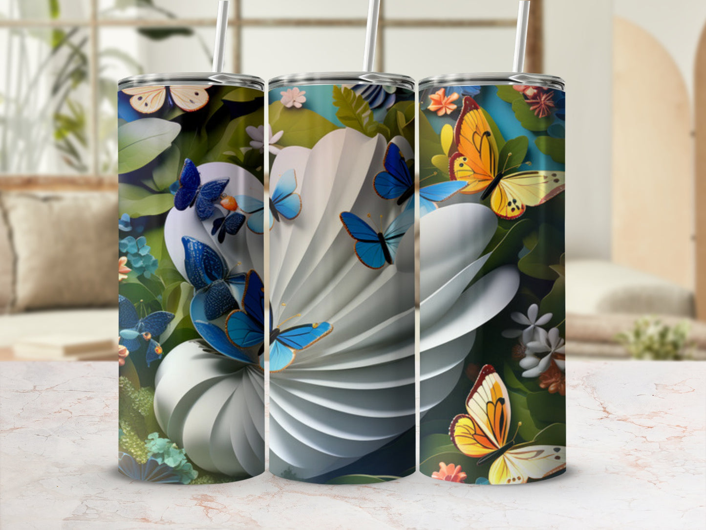 Three tall tumblers with butterfly and floral designs.