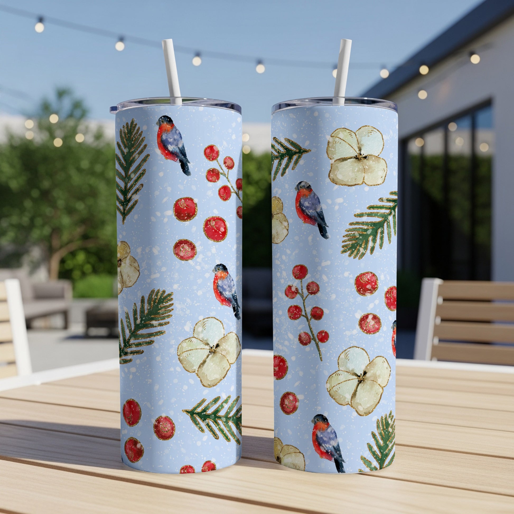 Two light blue tumblers with festive bullfinch and berry pattern.