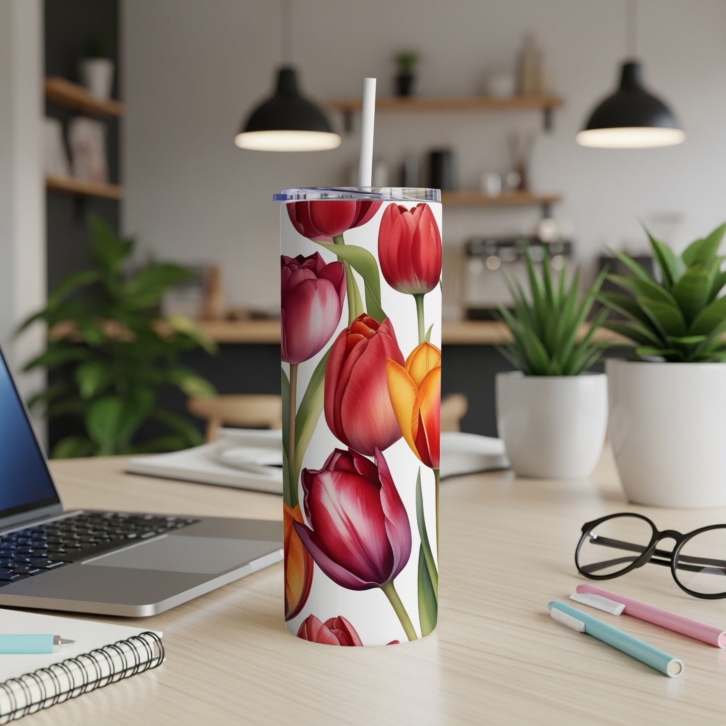Tumbler with a pattern of red and yellow tulips.