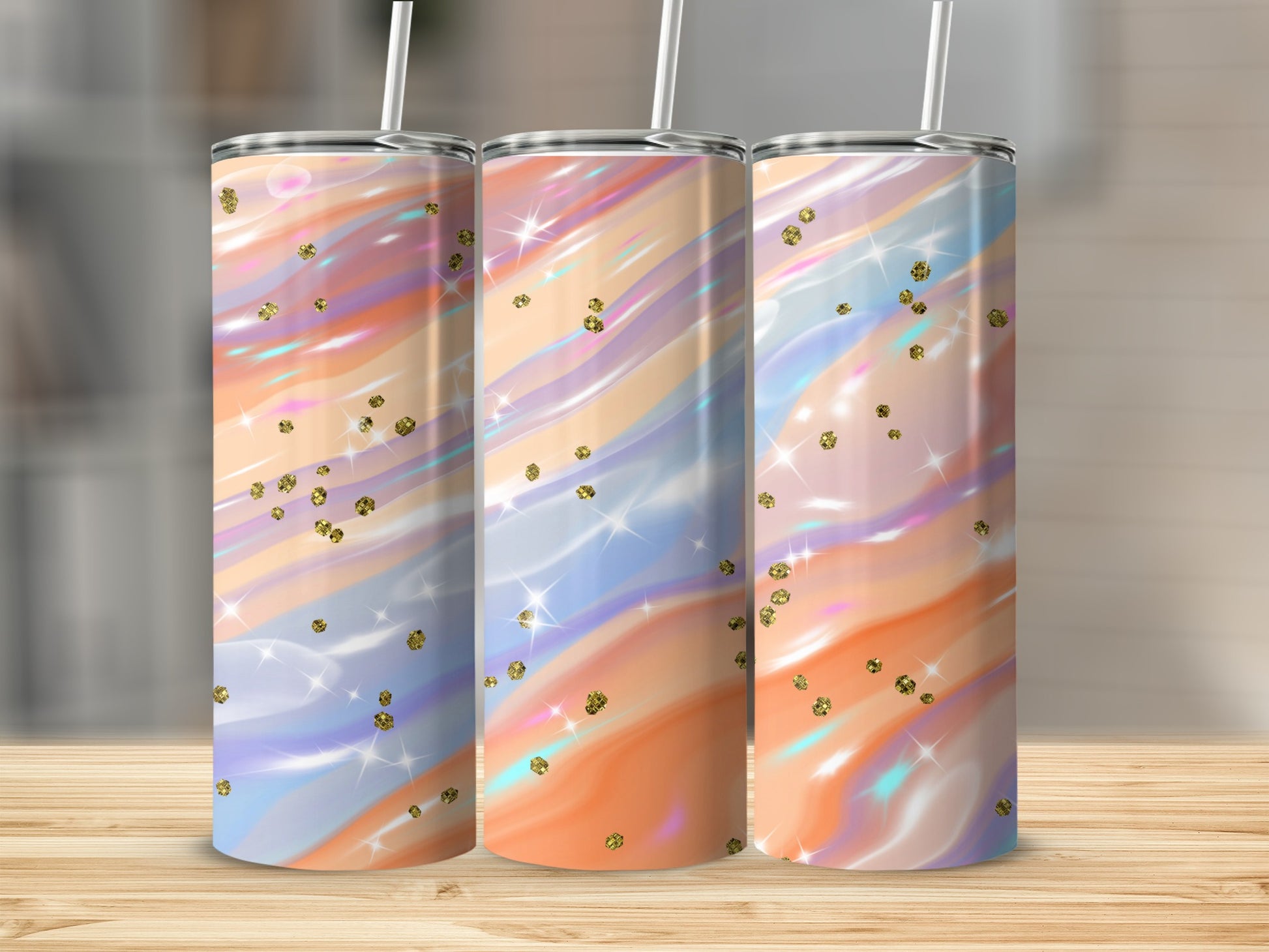 Three tumblers with a swirling pastel design and gold glitter accents.