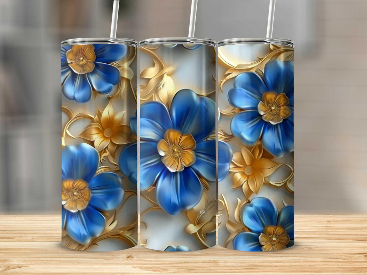 Three blue flowers with gold accents and leaves on a white background.