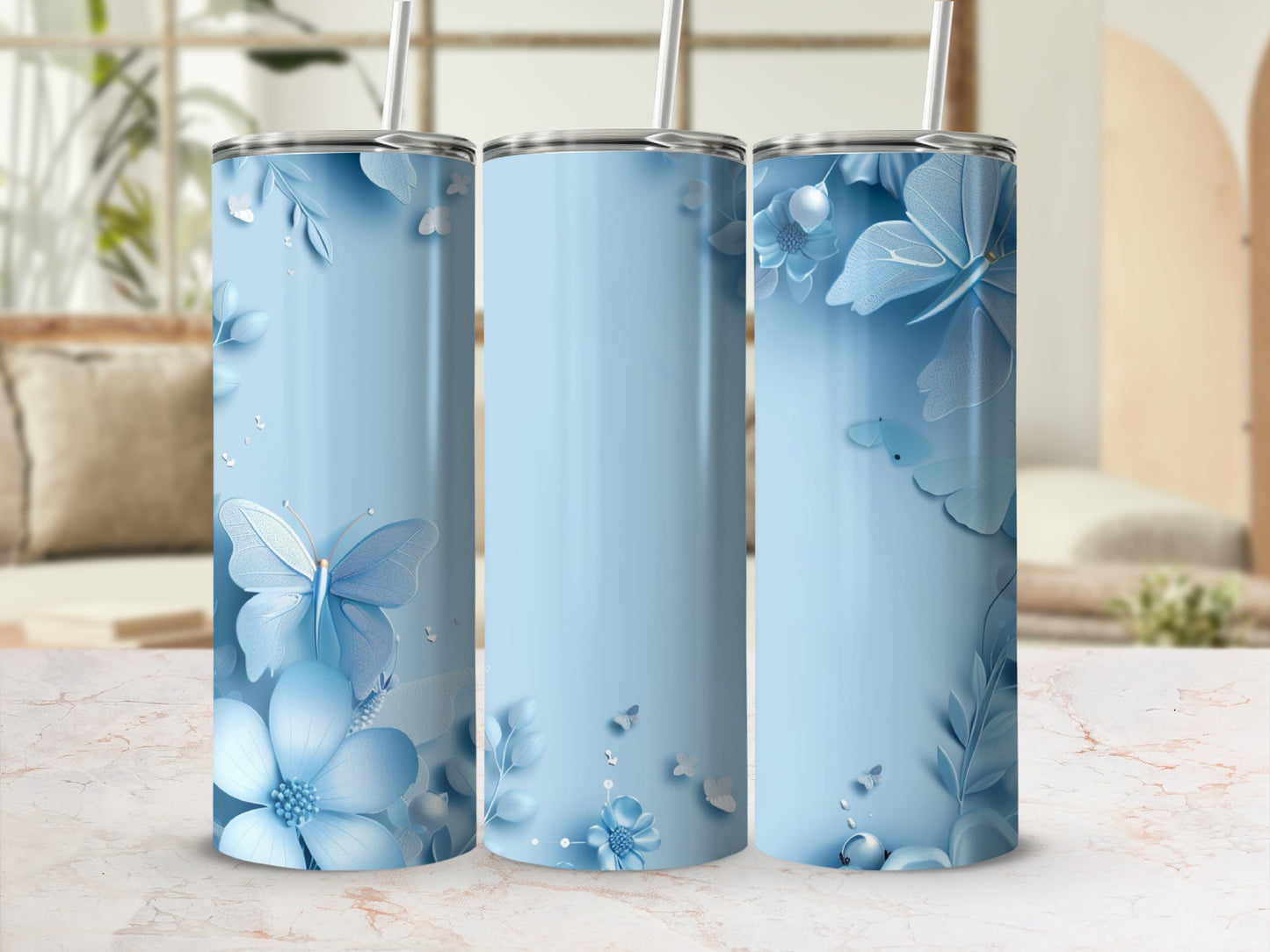 Light blue tumbler with floral and butterfly pattern, shown in a lifestyle setting.