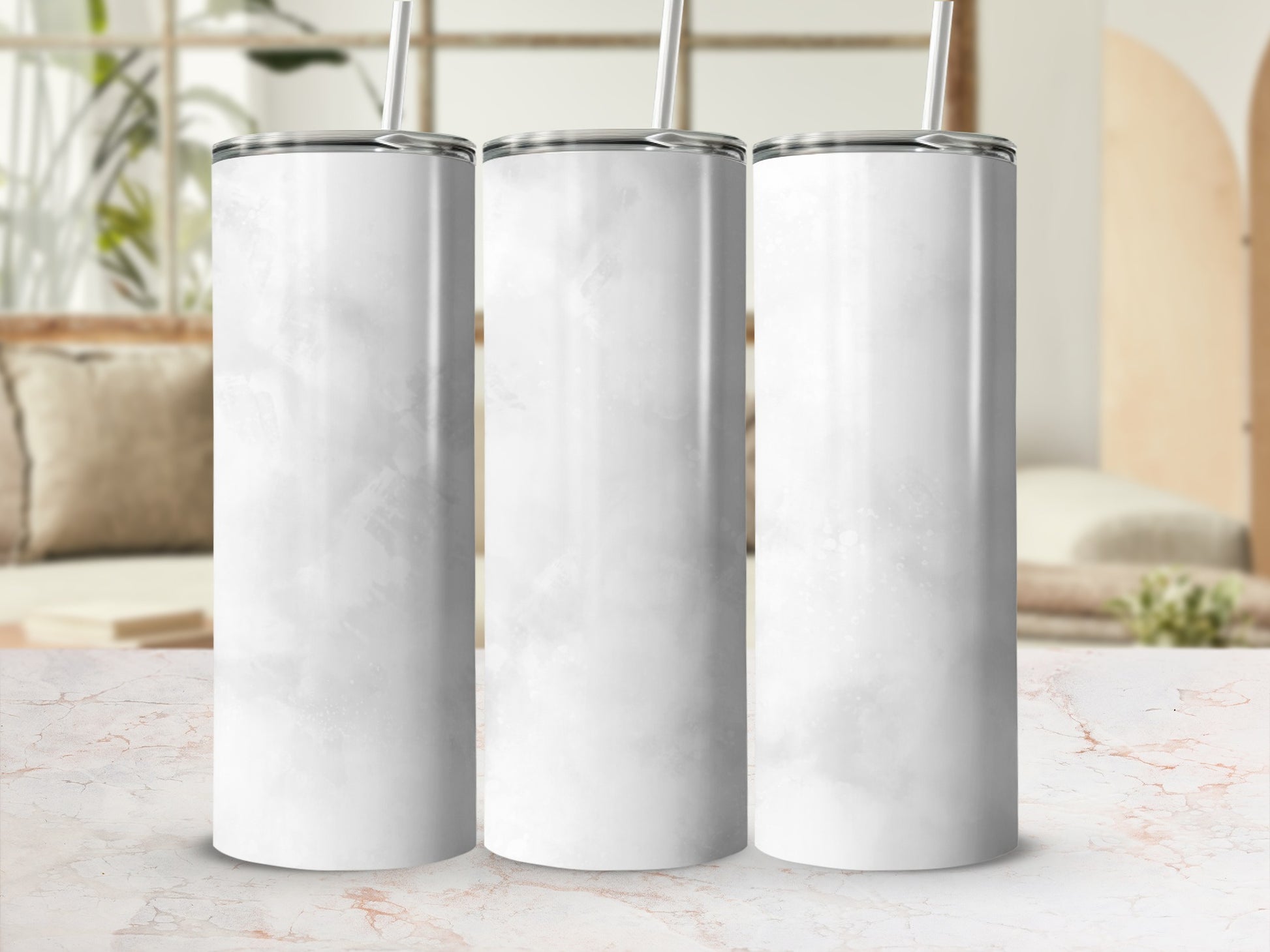 Three blank white tumblers with subtle watercolor texture.