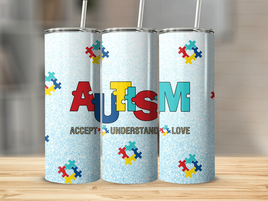 Autism tumbler with puzzle pieces and "Accept Understand Love" text.