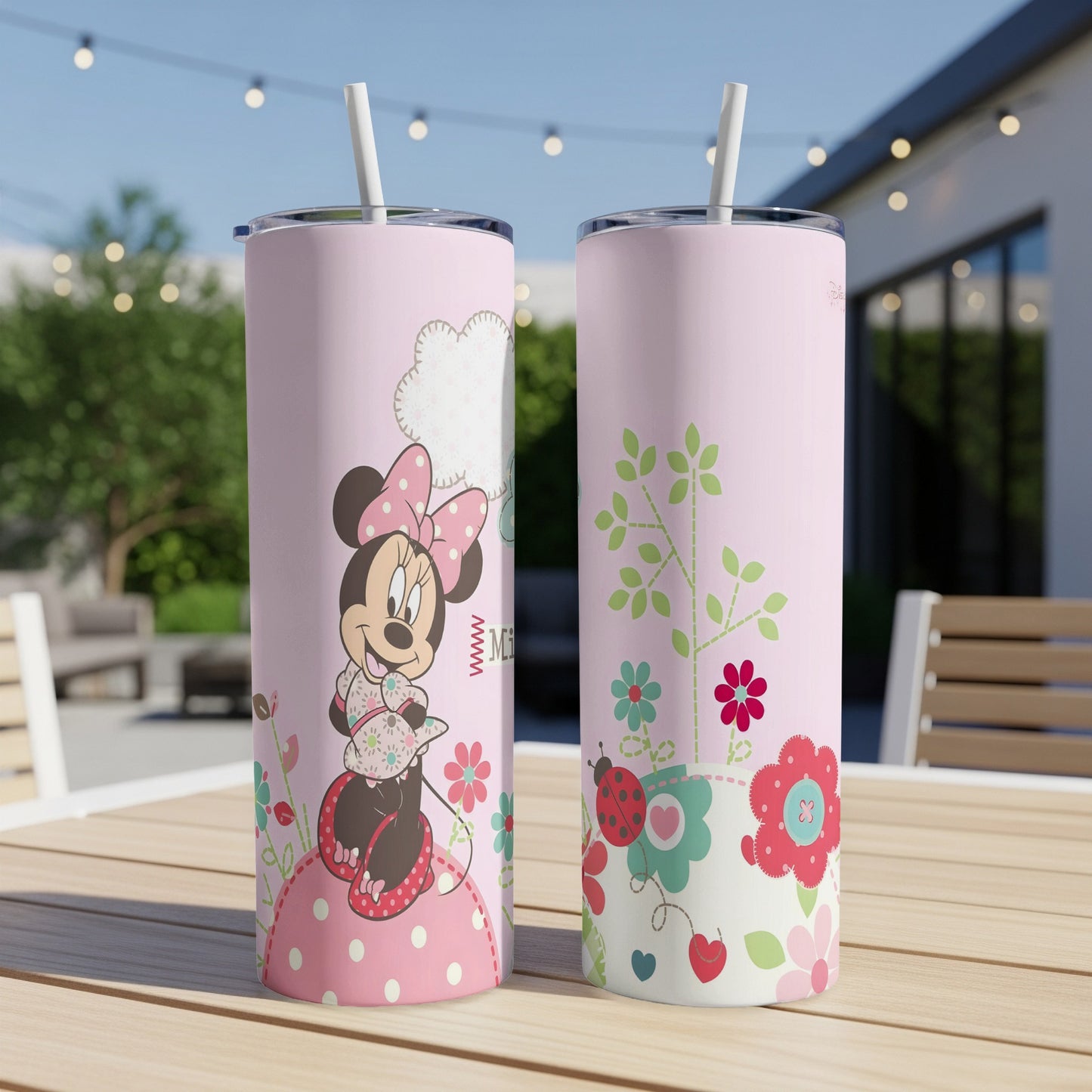 Pink Minnie Mouse tumbler with floral and ladybug design.