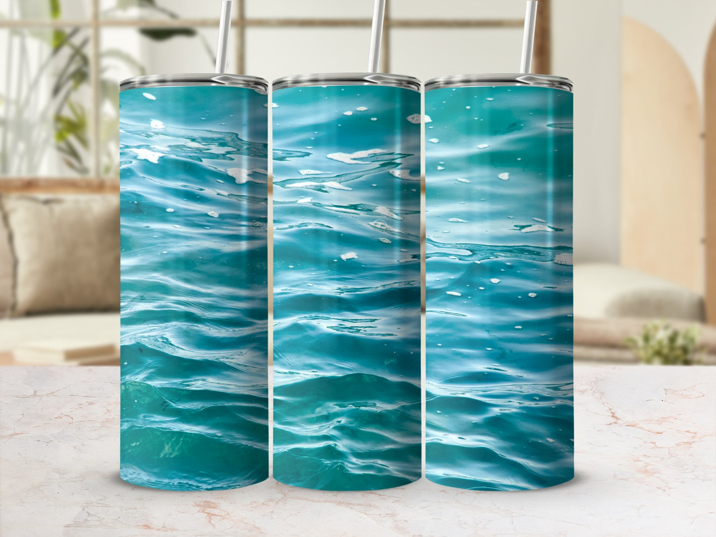 Three tumblers with a blue water surface design.