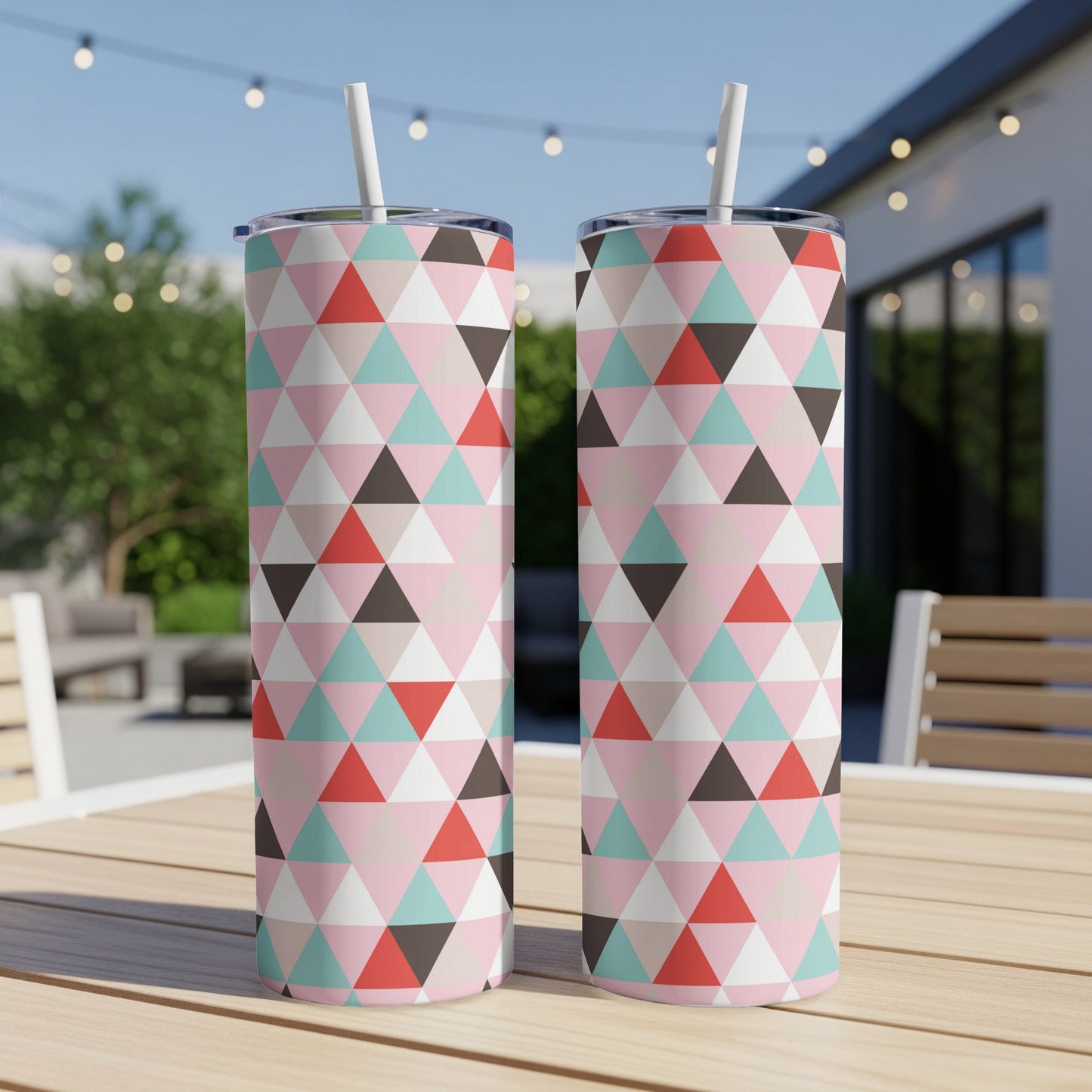 Two tumblers with a geometric triangle pattern in pink, mint green, and red.