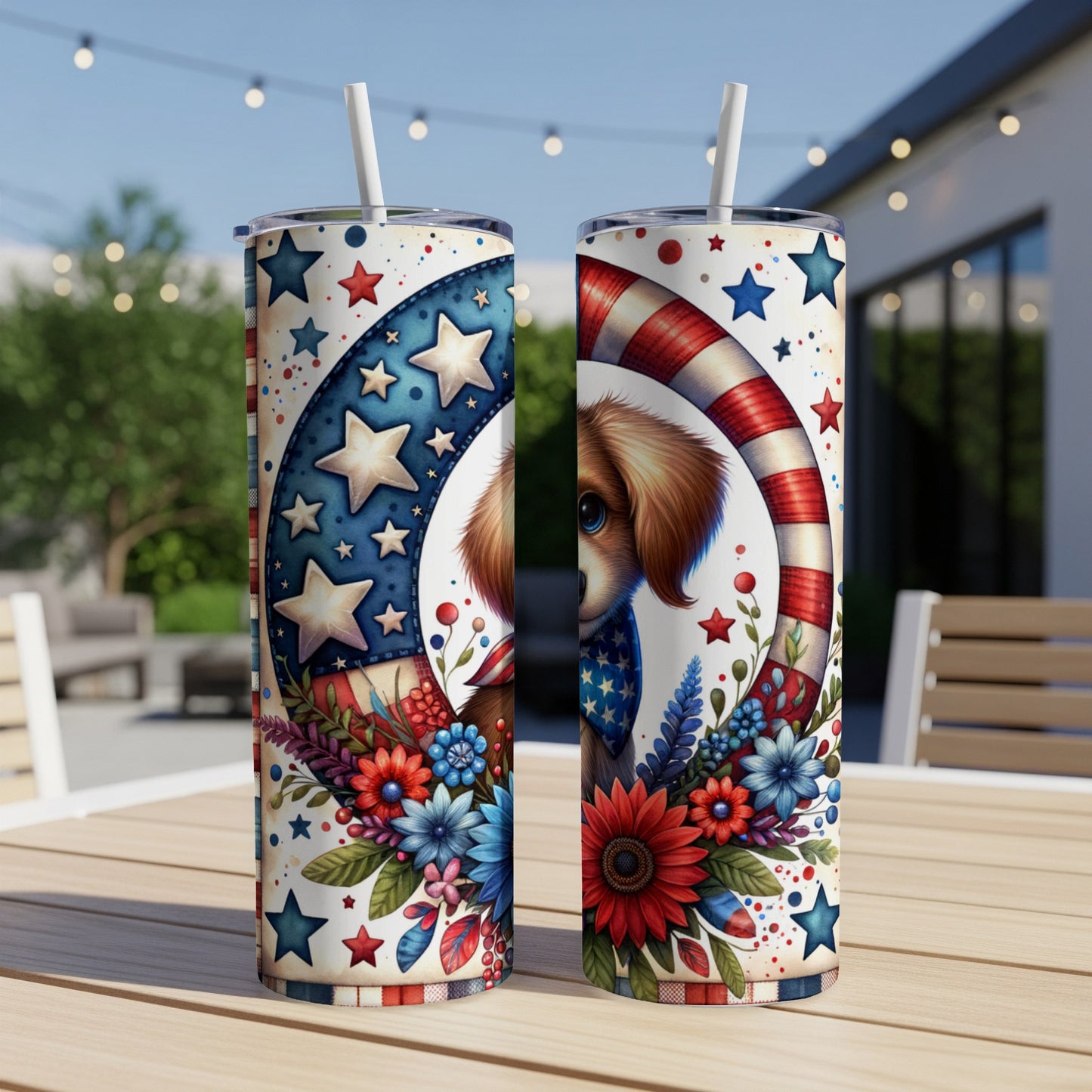 Two patriotic tumblers with a dog and floral design sit on a table.