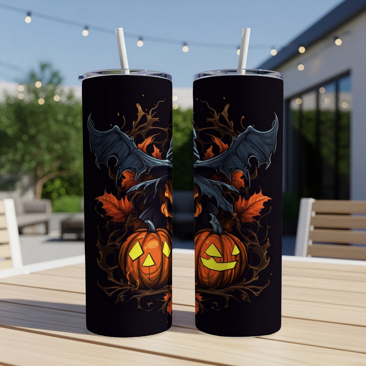 Two tumblers with a spooky Halloween design featuring jack-o'-lanterns and bat wings.