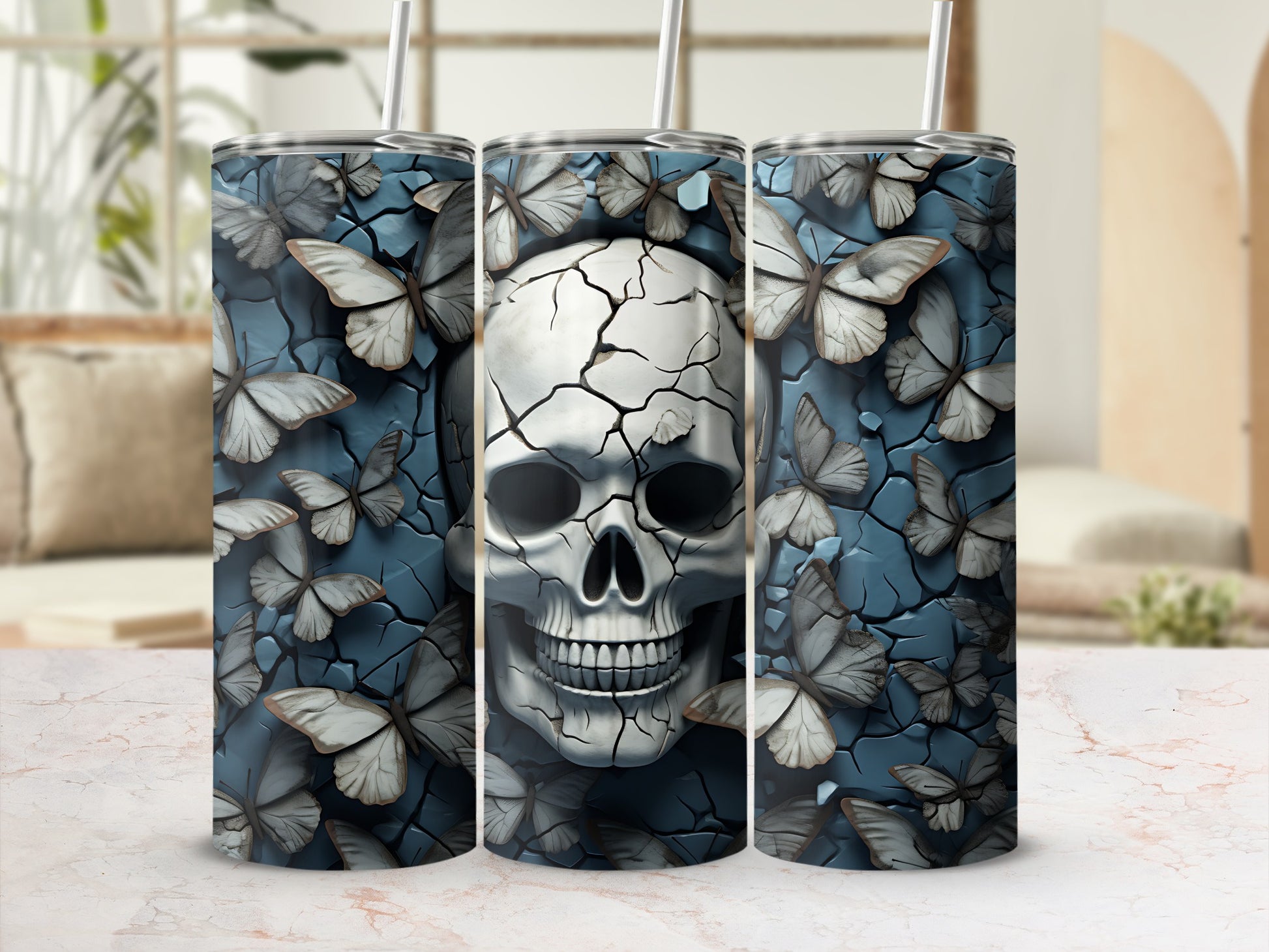 Cracked skull and butterflies design on three tumblers.