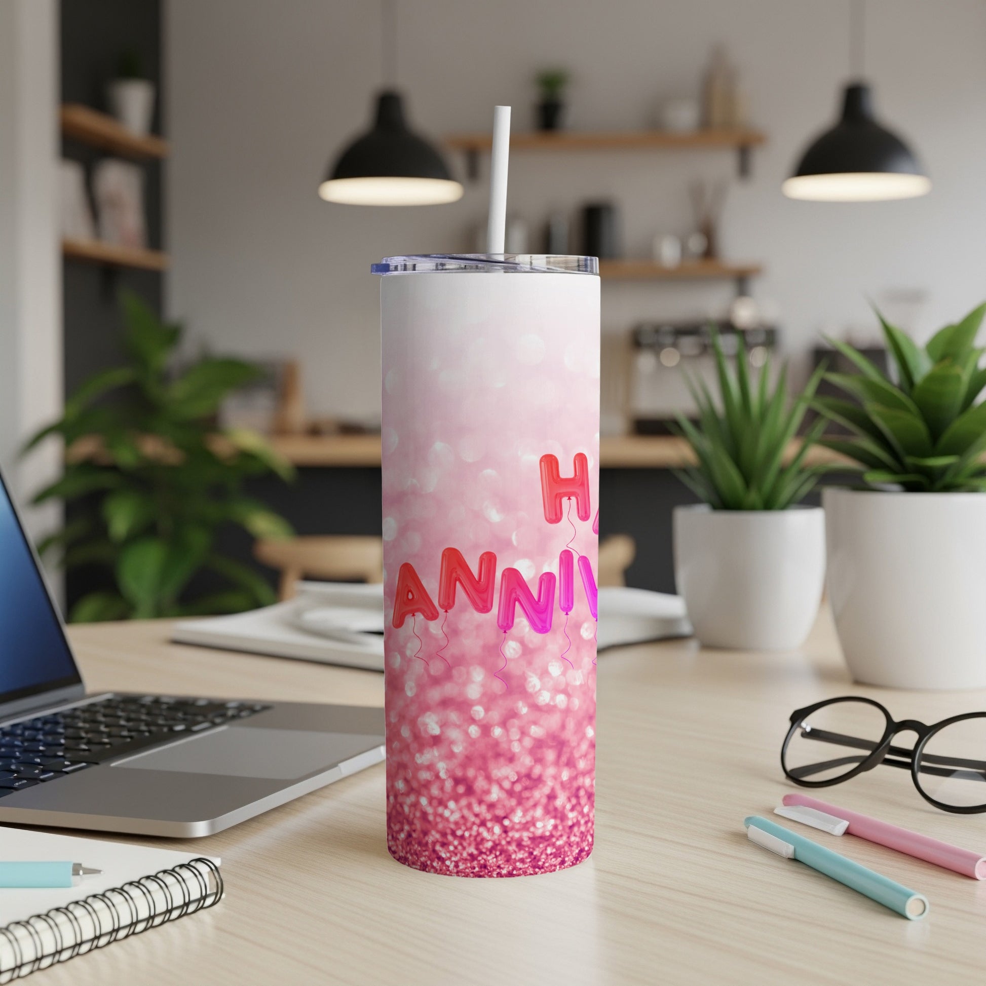 Glittery pink tumbler with "Happy Anniversary" balloons and text.